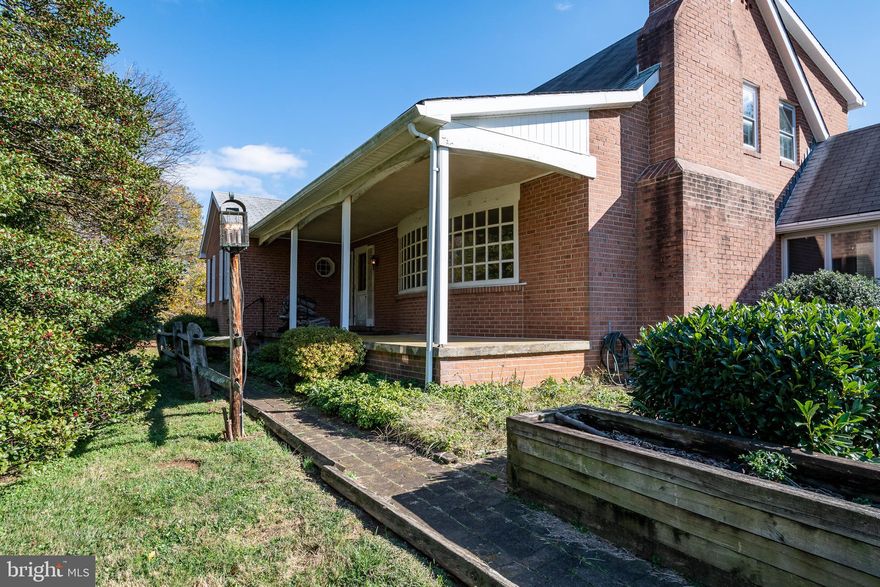 PRICE ADJUSTMENT!!*****This quality custom brick home abounds charm and character! Beautiful random width hardwood floors* Spacious living and dining room with brick wood burning fireplace*Currently 6 bedrooms* breezeway, 2 car garage with shop area above*2 car pole barn with storage space* Beautiful large flat lot which is partially fenced for pets* This home provides a fabulous foundation for so many creative possibilities/updating* To be sold as is. Tax records  incorrect 2506' *