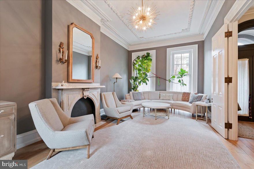 Looking for magnificent original architectural details with all the best modern amenities? Look no further than 2133 Green St,  a gorgeous home on arguably the most desirable block in the Art Museum area.  This 3300+ SF Victorian home, circa 1900, has 5 bd/4.5 ba, 2 laundry rooms, bleached walnut floors throughout, 2 zone HVAC and gated parking for 2 cars.  The brick and brownstone entrance has an elegant large front garden, set back from Green St.  The first floor sitting room has 12' high ceilings, stunning original and intricate plaster mouldings, floor to ceiling windows and an original mirror built into the entry wall.  The kitchen is modern and spectacular - Venetian plaster, Bulthaup cabinets, Sub Zero fridge, Miele oven and stove, Carrera marble counters, a line of operable glass doors that open to outside,  powder room and coat closet,  and a gas fireplace with a mantel top from India and salvaged side pieces from a historic Malvern farm.  The upstairs rooms are all very well proportioned with special features including reclaimed shutters as doors, exposed beams and antique barn doors.  Bache Martin elementary. Walk to the Philadelphia Museum of Art, Franklin Institute, Whole Foods and more!