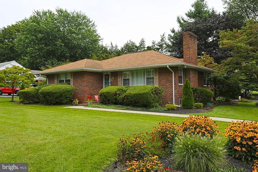 Charming all brick rancher on gorgeously landscaped corner lot.. a stunning turn key home --- wood floors, custom plantation shutters in LR & DR. Custom bookshelves frame wood burning fireplace. Kitchen open to DR has 5 burner gas range, stainless appliances & granite. LL rec rm has great wet bar, full bath, BR or office option, Enjoy the breeze from lovely patio with custom pergola out back!