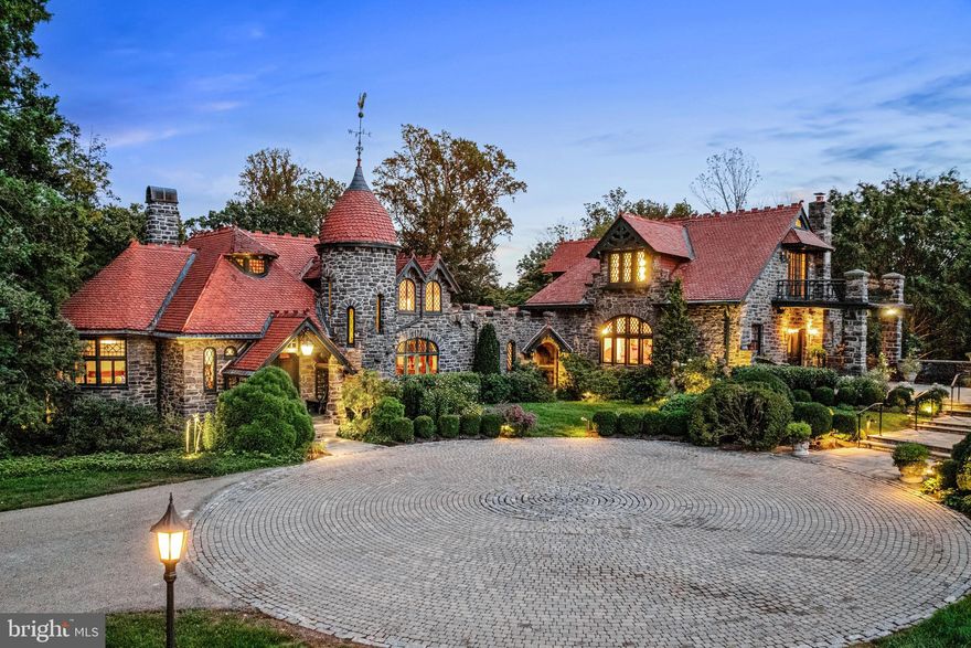 WOW!!! This incredible Radnor estate built in 1882, was once known as Fox Hill Farms and was originally sited on 560 glorious acres at the highest point in Bryn Mawr. Now set on 5 beautifully landscaped private acres with flowering perennials, specimen trees and breathtaking views, the fabulous stone main residence with tile roof and tennis court awaits its next lucky stewards.  The current owners have meticulously restored the original architectural designs and materials, while completely modernizing the infrastructure and amenities of the residences including updated HVAC, electrical systems, new generator and more. Endless features that afford comfortable everyday living and easy entertaining include sun-filled leaded glass arched and eyebrow windows, fabulous wide plank floors, massive mahogany moldings and millwork, gracious entrance foyer, soaring great room ceiling with restored log beams and walk-in Philadelphia brownstone fireplace, expansive dining room with hidden wet bar private office, large cherry eat-in kitchen with prep island, gas cooktop, double ovens, SubZero refrigerator, breakfast room and enormous "icebox" pantry, 2 first floor powder rooms, cozy family room off of kitchen area and a generous first floor guest bedroom suite with full bathroom. The main staircase is dedicated to a spacious second floor Primary Suite with gracious bedroom opening up to 2 balconies with glorious views of the gardens, grounds, terraces, stone walls, flowering pergola and water fountain, 2 customized walk-in closets, sitting room with fireplace, luxurious bathroom with sunken tub, walk-in frameless glass shower and separate commode room. A second staircase leads up to a third bright bedroom suite with bright bedroom and bathroom featuring endless views of the jaw dropping grounds. The dry, partially finished lower level offers a potential 4th bedroom with full bathroom, exercise area, laundry room and lots of storage The stately guest/ gate house also offers private living or working spaces with a potential 5th bedroom, full bathroom, kitchen and living/ dining room.  This incredible, one-of-a-kind historic oasis offers endless opportunities for expandable spaces to suite any buyer's desires. Close to renowned Radnor schools, and private schools and universities, a wide variety of recreational facilities, clubs, all forms of transportation, wonderful restaurants, Philadelphia Airport and more. A rare jewel!! LOW TAXES!