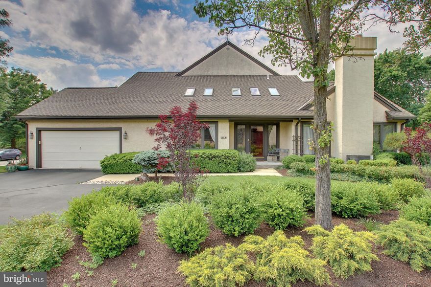 Rarely offered end unit townhome with first floor master suite in the sought after community of Steeplechase.  Large living room with cathedral ceiling, beautiful  gas fireplace, oversized windows and outstanding view of the gardens thru the French doors leading to the oversized paver patio.  The foyer and dining room also offer cathedral ceilings with skylights.  The newer kitchen has all the upgrades needed to impress.  The den features built ins as well as an additional door to the patio.  The master bathroom has been totally renovated featuring a very large shower with multiple shower heads.  Two separate vanities, with beautiful tile throughout.  Laundry room and powder room complete the first level. Two oversized bedrooms and hall bath are on the second floor. The lower level is finished providing additional living space and storage.  A two car attached garage with a large driveway for additional parking.  The property has been professionally landscaped for a dramatic appearance.  Located in the award winning Wissahickon School District and close to major highways, restaurants, and shopping.