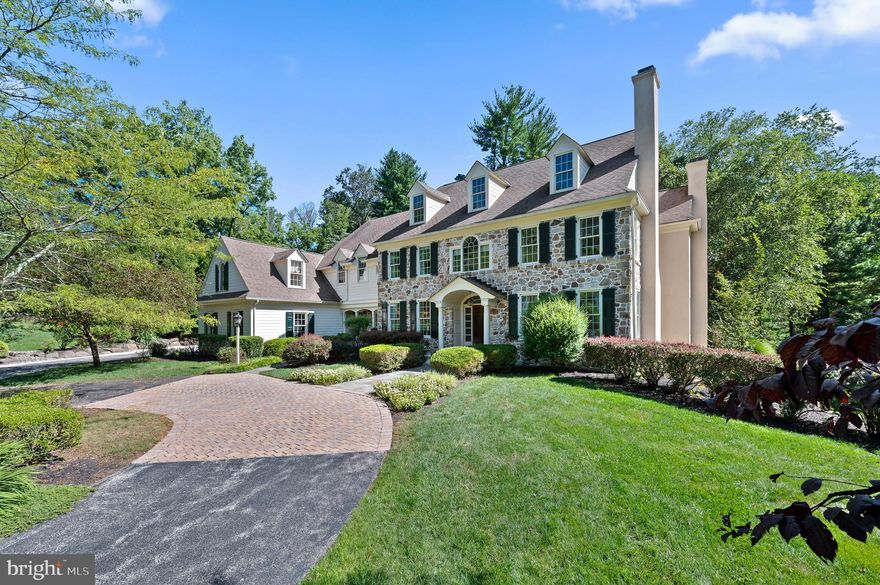 Sited well back from the road in a breathtaking setting, experience timeless elegance in this stately center hall colonial masterpiece, nestled in the heart of Newtown Square.

As you step inside, a  formal living room awaits to your right, featuring its own gas fireplace for a warm ambiance. Further enhancing the sophistication, an adjoining library or office comes complete with built-in bookshelves and a second gas fireplace—perfect for cozy reading sessions. Nestled conveniently between the library and the welcoming foyer is a powder room.

To the left of the entrance, you'll find an opulent dining room, designed for indulging in formal dinners. The adjoining mudroom, which leads to a spacious three-car garage, ensures that practicality meets luxury.

At the heart of the home is a well-equipped kitchen boasting several luxurious features: a center island, state-of-the-art Viking stove, dual KitchenAid dishwashers, and a bespoke KitchenAid refrigerator with a cabinet finish. Culinary enthusiasts will appreciate the double wall oven, surrounded by ample storage and cabinetry. The expansive breakfast area, with its charming French doors, offers a seamless transition to the outdoors. Adjacent to this, step down into a family room enriched by a third gas fireplace.

Navigating the home is easy with both front and back staircases leading to the second floor. Here, a sprawling landing beckons. The luxurious primary suite flaunts a sitting area, dual walk-in closets, and an ensuite bathroom with features such as double sinks, a sunken tub, and a walk-in shower. The second floor also offers an ensuite bedroom, two hall bedrooms sharing a bath, and a secluded ensuite bedroom near the back stairs. Added convenience is provided by a second-floor laundry room.

Venture to the fully finished lower level where luxury continues with a den that showcases a fourth gas fireplace, a wet bar equipped with a wine fridge, a billiard room for entertainment, and a dedicated exercise space. Another full bath completes this level, and it even provides direct access to the garage.
Elevating the appeal, the home has several upgrades including built-in bookshelves and cabinets in the basement, surround sound ceiling speakers, upgraded low-emission fireplaces, and a custom kitchen backsplash. You'll also find distinctive cabinetry in the music room, office, primary closets, additional bedroom, and garage, along with an ADT remote alarm system, Honeywell remote thermostats, and exquisite landscaping.