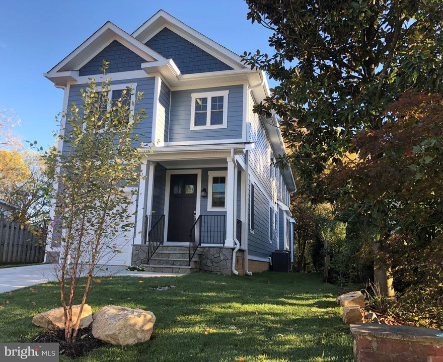 PRICE REDUCED*****Bright, open, airy, new A&N Home backing to trees and bike path to Ballston. ***Deceptively large and built with quality features.***Light streams through the many Low E Pella windows and comfort is ensured with 2  zone heating and cooling**High end kitchen with Shrock cabines, Bertazzoni appliances, including gas range, quartz countertops, Kohler farm sink. ***Just off the kitchen is the walk-in pantry and mudroom to one car garage.***  Vented gas fireplace in family room and atrium door to rear yard and patio; stained in place, tongue in groove, wood floors on two levels.****Appealing master suite with double walk in closets; large  master bathroom with soaking tub, double vanity, big linen closet.  Second bedroom with en suite bath and walk in closet.  Two more bedrooms share bath with double vanity, separate tub and toilet area.   Laundry conveniently located on this level. ***Daylight walkout lower level with big rec room, 5th bedroom, bath, and storage.  Walk along the bike path to Ballston Quarter and Metro; Ashlawn, Kenmore, Washington-Liberty.**