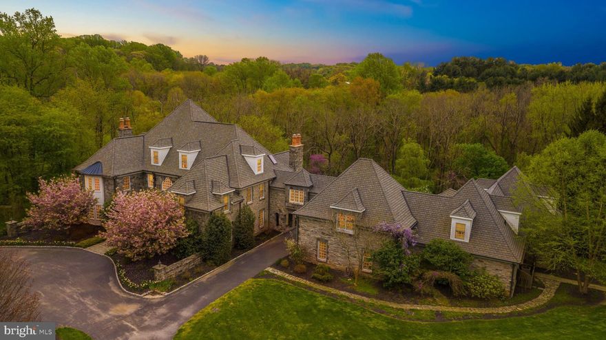Check out this link to the Virtual Tour, https://youtu.be/eA7cI6orrMQ  Tired of living in the city? Do you need your own estate where you really never need to leave? This home is for you then. Luxury at its finest only begins to describe this 16 Year old Manor Home majestically situated on 10+ private acres in Chester County, - only a few minutes away from Route 52 &  Greenville, Delaware.  This exceptional Old World Manor, complete with a rich gray Vermont stone facade.  Once inside the wood double doors, the dramatic Entrance Foyer welcomes you inside with gracefully curved Butterfly Stairs complete with wrought-iron balusters & rail along with heated Italian Marble Floors.  The Two-Story Library finished with handsome cherry wainscoting includes a breathtaking balcony accessed by a circular staircase & showcases a 20ft tall coffered ceiling.  Adjacent to the spacious Living Room with Fireplace is the Celebration Ready Dining Room with a hidden china closet, available to seat 20!  The Chefs Delight Kitchen offers a walk in Butlers Pantry and cabinetry galore along with the Gourmet Appliances, Commercial grade Thermador 6 burner gas stove and Breakfast Room looking onto the cozy Family Room with Floor to ceiling Stone Fireplace, Window Wall &  2-story Vaulted ceiling.  First Floor Guest Room with Full Bathroom and Formal Powder Room and spacious Office complete the main living level.  The Second Floor graciously offers the Master Bedroom Suite with Fireplace & private entrance to the Library, Spa Bathroom and his and hers walk-in Closets, along with Three Additional Bedrooms and Three Full Baths, Laundry Room, and a separate Wing for Flex Space.  The Third Floor features two Bedrooms with en-suite Bathrooms.  The Lower Level is available for entertainment with a Second Family Room with Pool Table, Full Size Mirrored Back Wet Bar with Six coordinating Bar Stools,  Home Theatre that seats 11, Stone Wine Cellar with space for 1,200 bottles & Stone Sink, Sauna Room, Steam room and Jacuzzi in addition to a Full Bathroom.  There are several French Door entrances opening to the Flagstone Patios and Terraces.  Luxuries such as radiant heated Foyer, Kitchen and Bathroom Floors Plus Entire Basement Floor,  beautiful Vermont cherry hardwood floors, and custom detailed wood trim grace this exquisite home.  An attached 5+ car garage with room for storage and work shop is another fine feature!  In addition, there is a walking path to a quaint two bedroom Cottage with updated Kitchen and Sunroom overlooking the pool, patios and pool house.  The Cottage has a detached two car garage.  This Property is a Must See!  Location is convenient to great dining, shopping, Fieldstone Golf Club and major routes.  Estimated 40 Minutes to the Phila Airport, 45 Minutes to King of Prussia Mall, 10 Minutes to Longwood Gardens.