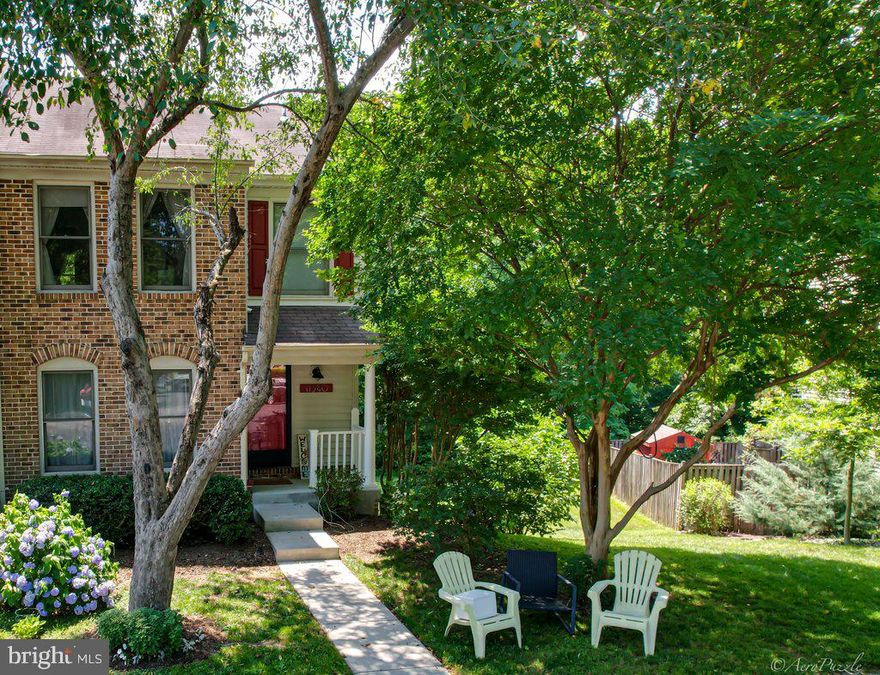 A must see, this lovely brick front, end unit townhouse with 3 finished levels, showcases a view of the Occoquan Reservoir. This home offers 3 spacious bedrooms, 2 full baths and 2 half baths in the amenity rich community of Lake Ridge. This meticulously maintained home is move-in ready with a large owner bedroom, walk-in closet, updated ensuite and hallway bathroom. The carpet in the upper level has been recently professionally cleaned. On the main level, you will be welcomed with gleaming hardwood floors, a formal living room and a dining room with a bay window filled with natural light. Finishing off this level is a convenient updated half bath. You will love the kitchen with white cabinets and vinyl luxury flooring. The breakfast area leads you to two new sets of double glass sliding doors where you will enjoy the rear deck overlooking a wooded view. The walk-out lower level features a wood-burning fireplace, laminate flooring and a second half bathroom. The large and private side and backyard are great for entertaining family and friends. The two reserved parking spaces are conveniently located in front of the home. With over 1,200 acres cared for by Lake Ridge Association, a variety of amenities are available to homeowners including 5 swimming pools, walking trail, tennis courts, boating, pickleball, basketball, fishing, kayaking and more. Minutes to I-95, commuter lots, restaurants and shopping. Hurry, this home will not last long!