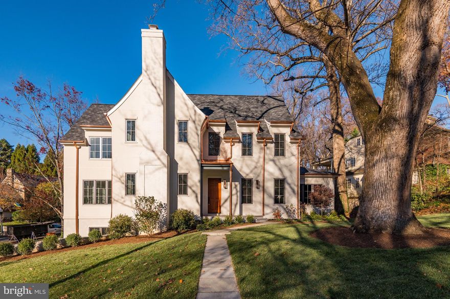 Another brand-new stunning residence by Brush Arbor Home Construction!  In collaboration with Wellhouse & Co Interior Design, they have created a bespoke residence sited on a coveted .35 acre corner lot in prime Spring Valley. Details like copper gutters and a classic painted brick chimney lend exceptional touches of elegance to this custom new build and design, spanning 5 BR 5.5 BA, and 6,600 SF. There is an optional 6th bedroom suite on the Main Level. 
 
French windows and doors anchor all the primary spaces, yielding bucolic views as well as access to multiple porches, patios, and decks. Gorgeous herringbone floors in the front foyer welcome guests into a light-filled floor plan that integrates 10' ceilings, custom interior and exterior millwork and architectural details, 7" character grade white oak floors, Ply Gem windows and doors, designer finishes such as lighting by Visual Comfort and fixtures by Kallista, and natural finishes such as black honed granite, white carrara marble and polished nickel.  
 
The second level includes an extensive primary suite with 14' cathedral ceiling, fireplace, private balcony, two walk-in-closets, and the designer tile and custom cabinetry of a spa-inspired bathroom. Secondary bedrooms echo the pattern of discerning finishes, all with ensuite baths and walk-in closets. The lower level boasts a bedroom and ensuite bath with full windows, a generous recreation room with bar and a mudroom adjoining the two-car garage. On each level, there is an elevator-ready shaft for potential installation. 
Located in Washington, DC's premier Spring Valley neighborhood. Convenient to Downtown Washington, Georgetown, and Maryland Suburbs. The Kennedy Center, White House and some of the country's best universities including American University and Georgetown University are just minutes away. All of the activity, shops and restaurants of Massachusetts Avenue, Wisconsin Avenue and MacArthur Boulevard are only moments away. Reagan National and Dulles International airports are a quick commute.