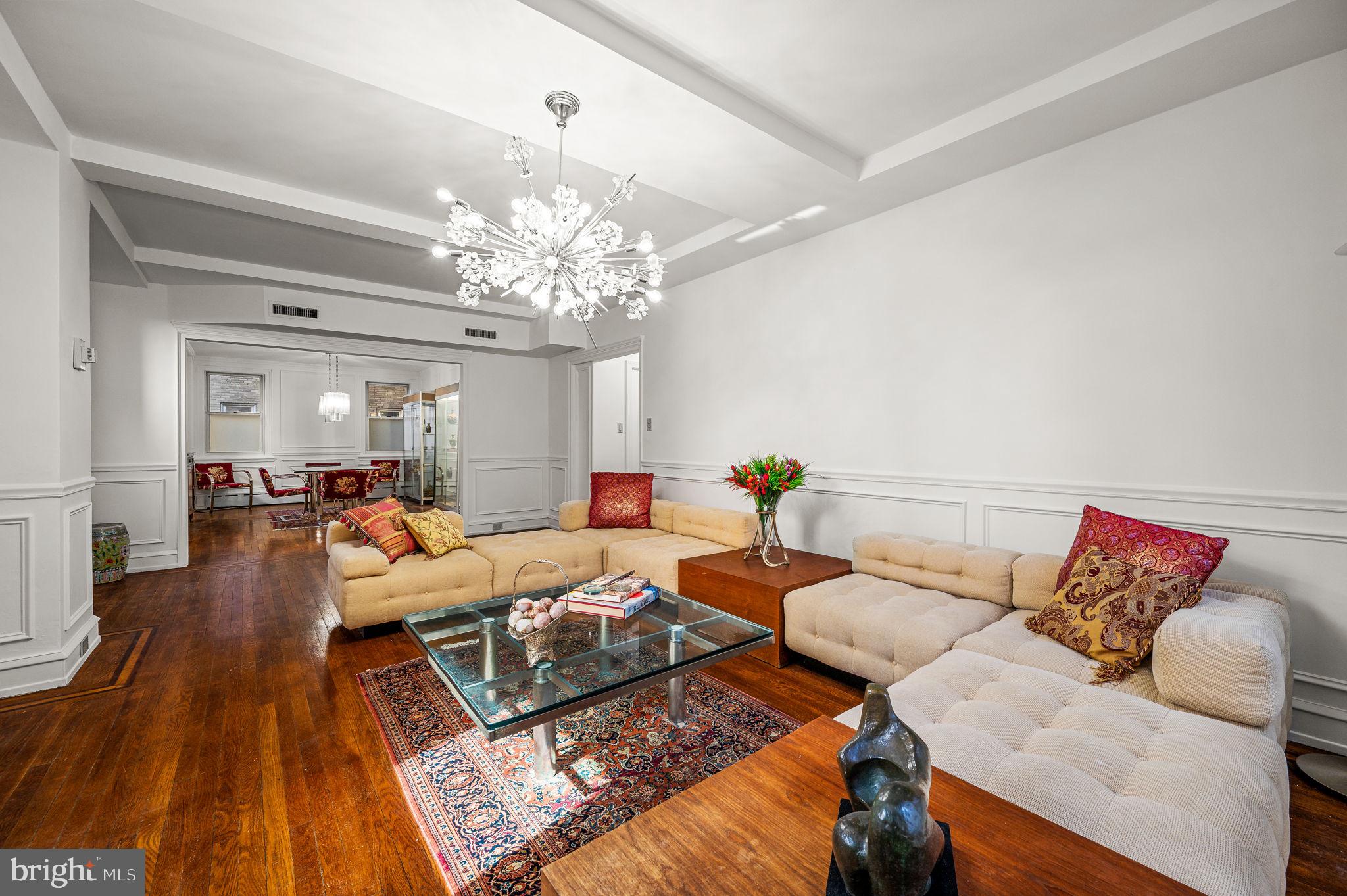 Welcome to #3C a 2-bedroom, 2-bathroom residence spanning 1,440 square feet in the prestigious Rittenhouse Plaza. Enter through the gallery hallway, offering the perfect space to showcase your art collection, and discover an abundance of storage, including two linen closets and an expansive walk-in closet with a built-in desk just off the entryway. The eat-in kitchen is both functional and inviting, with a small breakfast bar, abundant storage and counter space, and a layout designed for easy everyday living. The formal dining room is ideal for entertaining, while the living area showcases original inlay hardwood floors, wainscoting, and timeless architectural character. The spacious primary suite features a large hanging closet, while the second bedroom boasts an ensuite bath and an extra-deep closet with custom built-ins. The Rittenhouse Plaza is one of Philadelphia's rare New York-style pre-war buildings, offering pet-friendly living and a stunning courtyard garden. Residents enjoy a 24-hour concierge and the unbeatable convenience of living steps from Rittenhouse Square. The monthly co-op fee includes real estate taxes, Fios cable, internet, heat, water, sewer, and building maintenance. A one-time co-op transfer fee of 1% of the purchase price is payable at closing. Nearby parking options are available for rent within a block of the building. With its charming details and an unbeatable location, this home is a great opportunity to live in the heart of one of Philadelphia’s most iconic neighborhoods.