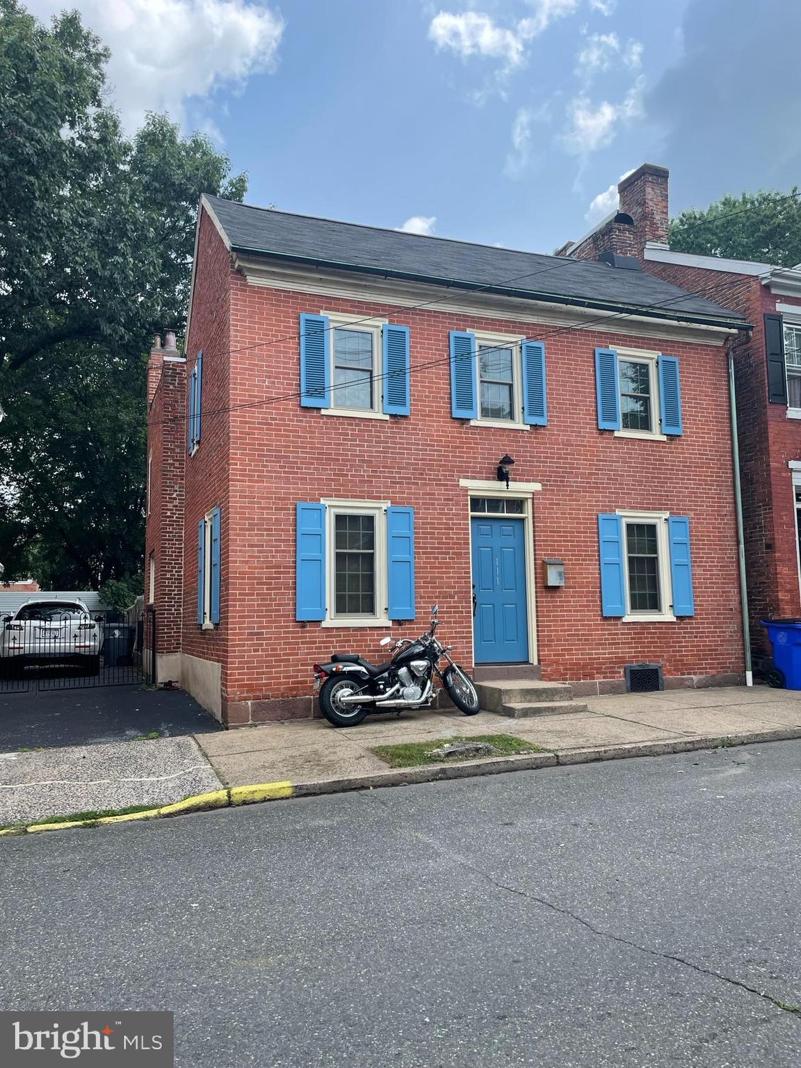 Welcome to 111 Chestnut St,  where you have found this charming and eclectic home with modern-day updates.  This home was a historic Mason's meeting house. It was built in 1860, and it was built to last! This home features exposed brick, stone, beams, and a gorgeous stained glass window tucked in like a secret. The family room offers hardwood floors, updated windows, and plenty of room for furniture.  An old eclectic door takes you into the dining room where you'll immediately notice the exposed beams that have held this house for over a century. The fireplace has a cast iron front that is over 100 years old, but it is updated with an electrical insert. The floors are knotty pine just refinished enough while keeping with the history of the home. The kitchen has all of today's modern conveniences and a generous amount of cabinet space. There is room for an island and an eat-in area.  The kitchen has beautiful wood trim at the entry and more exposed brick. From the kitchen, you can step out to the sunroom. What a cute little sunny place to have a little dinette table or make a gardening room. The backyard reminds you of a storybook with just enough sun, the beauty of the plants, trees, and gardens. The yard is fenced in and has a large shed that fits many items and also has space for overhead storage if needed. There is an additional shed behind the main shed for additional storage! When it is time to retreat, you can head upstairs and in the hall, you will notice the built-in bookshelves on the half wall, a large storage walk-in closet, and an old stained glass window from the Mason's who once met here. The upstairs hall bath also has built-in shelves and more exposed brick to add to the charm. The first bedroom is large enough for all the furniture you'll need, bright windows, the continuance of the hardwood floors, and offers access to the floored walk-up attic. The second bedroom has more charm galore with the exposed brick wall, architectural ceiling and knotty pine floors.  This home has been modernized with Central Air/ Heat, a second full bath, and updated electricity. The property is well-cared for and has been lovingly preserved.  Come make your appointment at 111 Chestnut Street and make your offer!