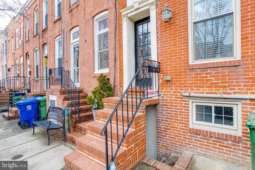 ADJUSTED TO SELL! Discover this charming 3 bedroom (1 in the basement level), 2 1/2 bath row home nestled in the lively Locust Point neighborhood. This fully updated home features around 1,400 SF of finished living space ! You'll love the open floor plan on the first level with sophisticated crown moldings and kempas hardwood floors throughout, this home offers both elegance and comfort. Entertain in your recently updated kitchen with SS appliances, granite and new lighting. The primary and guest bedrooms each come with modernized en suite full bathrooms. Additional conveniences include a main level powder room and laundry and roomy walk-in closets upstairs. Ideally situated near top-rated schools like Digital Harbor High and Francis Scott Key Elementary/Middle and just a short stroll from shopping at Southside Marketplace. Unwind at Fort McHenry National Monument or simply cross the street to enjoy Latrobe Park and the vibrant community. This home seamlessly blends comfort with convenience.