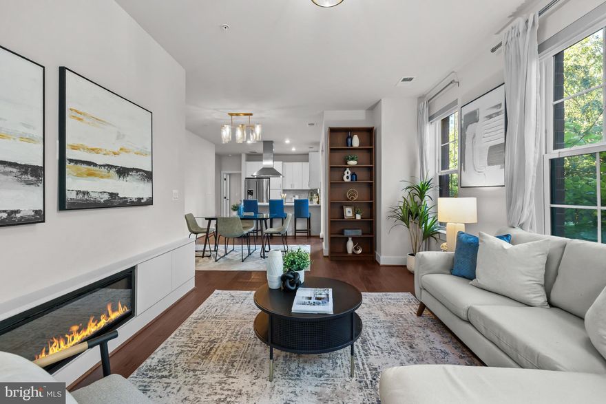 **Price adjustment! Also, this home can be purchased with an interest rate as low as 5.25%! See below for details** Beautiful 2 BD/2BA unit in LUXURY modern Key & Nash condo. Welcome to Rosslyn at its finest! This turnkey, light-filled 1,115 square foot condo in the heart of walkable Rosslyn is fresh and ready for its new owners! Built in 2018, this practically new home features expansive windows for wonderful light throughout and a flexible, functional 2 bedroom layout. Inside you will find fresh neutral paint, gorgeous wide-plank hardwood floors, an open floor plan, and a large private balcony just off the dining room. The STUNNING chef’s kitchen features quartz countertops and a chic waterfall peninsula, along with tile backsplash, premium stainless steel appliances, beautiful portal window, built-in microwave, and a designer apron-front sink. The kitchen is open to a spacious, open concept living room/dining area with plenty of space for a full-size dining table. The roomy primary suite overlooks the courtyard and features a spacious closet with a great organizing system. The spa-like en suite bathroom boasts dual sinks, a walk-in glass shower, and upgraded mirrors with integrated LED lighting. The second bedroom has a spacious walk-in closet space. A second full bathroom and in-unit stacked laundry make daily living a breeze. Beyond your four walls, Key & Nash features top-tier amenities including front desk concierge, a beautiful fitness center, party room, billiard room, bike storage, a secure package room, and fantastic outdoor recreation spaces. Spend time relaxing in the quiet courtyard with plenty of grills and seating areas, or head up to the gorgeous rooftop terrace! This unit comes with one assigned garage parking space, as well as a separate storage unit. Just 2 blocks to the Rosslyn metro station, or a short stroll to historic Georgetown via the Key bridge, come enjoy this PREMIUM location and all urban life has to offer! Minutes to Theodore Roosevelt Island, the Kennedy Center, Reagan National Airport, the Pentagon, downtown, the National Mall, numerous bike trails, convenient local shopping, and top-notch dining options - this is DC at your doorstep! **Ask listing agent for more information about low interest rate**