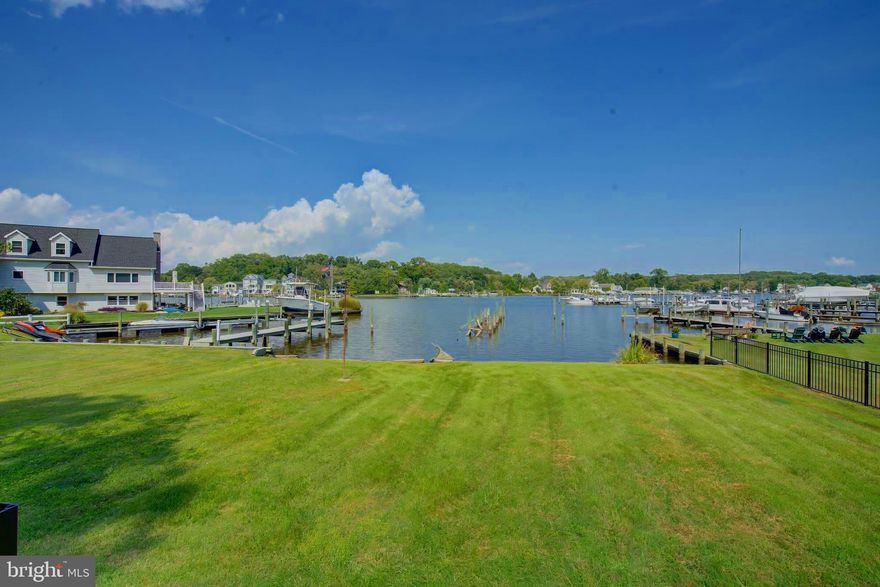 Welcome to 731 Seneca Garden Road, a stunning waterfront retreat on Seneca Creek that perfectly blends serene living with modern comfort. This beautifully remodeled 2-bedroom, 2-bath home features an open floor plan flooded with natural light, offering breathtaking water views and picturesque sunrises and sunsets from the kitchen and living areas.

The heart of the home is the exquisite kitchen, complete with a spacious island, elegant white cabinetry, stainless steel appliances and sparkling white quartz countertops. The two fully remodeled bathrooms add a touch of luxury, providing both style and functionality.

Step outside to your waterfront porch, the perfect spot to savor your morning coffee or unwind in the evenings while taking in the peaceful surroundings. The main living area offers easy access to this tranquil outdoor space.

For those seeking additional living options, the attic presents the potential to expand with a loft or kids bunk room. Beyond the main home, the oversized 2-car garage offers an incredible opportunity for further development. The garage's main level provides ample space for parking, a workshop, or storage for all your water toys. A charming sun porch off the garage offers partial water views and adds to the home’s appeal. A half bath is conveniently located on this level of the garage.

Ascend the extra-wide staircase to the unfinished upper level, a blank canvas ready for your vision. Whether you dream of a game room, man cave, guest suite, or a full in-law apartment complete with a kitchen and bath, the possibilities are endless with existing plumbing rough-ins that can be easily customized.

Enjoy the ultimate waterfront lifestyle with easy access to the bay. The property offers the opportunity to rebuild your own dock and lift to suit your needs.

Don’t miss your chance to own a piece of paradise at 731 Seneca Garden Road—where comfort meets tranquility on the water. Schedule your private tour today!