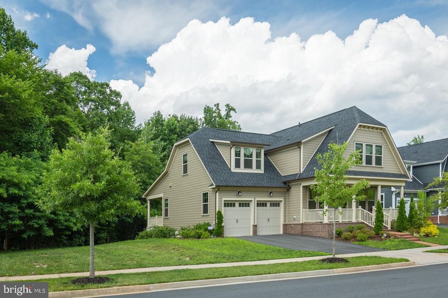 Multiple  Offer Situation-**Immediate Delivery Home****Sellers are downsizing, finally, their next home is finally ready, so now they can move!  If you have been looking at this home online now is the time to act. Seller motivated. Come see it.  This home boasts 9 ft ceilings and is one of the Tidewater Style homes that were built when Potomac Shores first started, The person who will like this home is the one looking for a relaxed open concept home with a social kitchen ( meaning the cook is apart of everything and see the TV! ) Only 22 people have a James in Potomac Shores. Think coastal cottage style living. That's the vibe this home has!  Let's talk about the lot.  All you see are trees from the inside of the home. You get a level backyard, double-wide walkup from the finished basement and plenty of room for a patio and you can fence this yard.  If you like what you see in photos this one could be yours in 30 days or less. It has everything. A front porch and a massive rear covered porch, dark engineered wood floors on the main level, high-end gourmet kitchen with the maple glazed linen cabinets with glass uppers, a butler's pantry, walk-in closets in the bedrooms upstairs, and upstairs dedicated laundry room, a luxury master bath. A finished lower level with room for a media room or den.  The HOA fee is $180 a month and that includes 150/150 internet, the state of the art fitness center, access to all the social events, access to The Shores Club and you can opt to join into any of the social clubs as a resident of Potomac Shores. The Wine & Beer Club, any of the Book clubs, The Garden Club, Bunco, the Lunch Group, The Cigar Society,  Water Aerobics, Dance, Paint-n-sip, Bunco and more. Potomac Shores is a Resort Style Living Community. Future VRE Station and Town Center expected within two years.