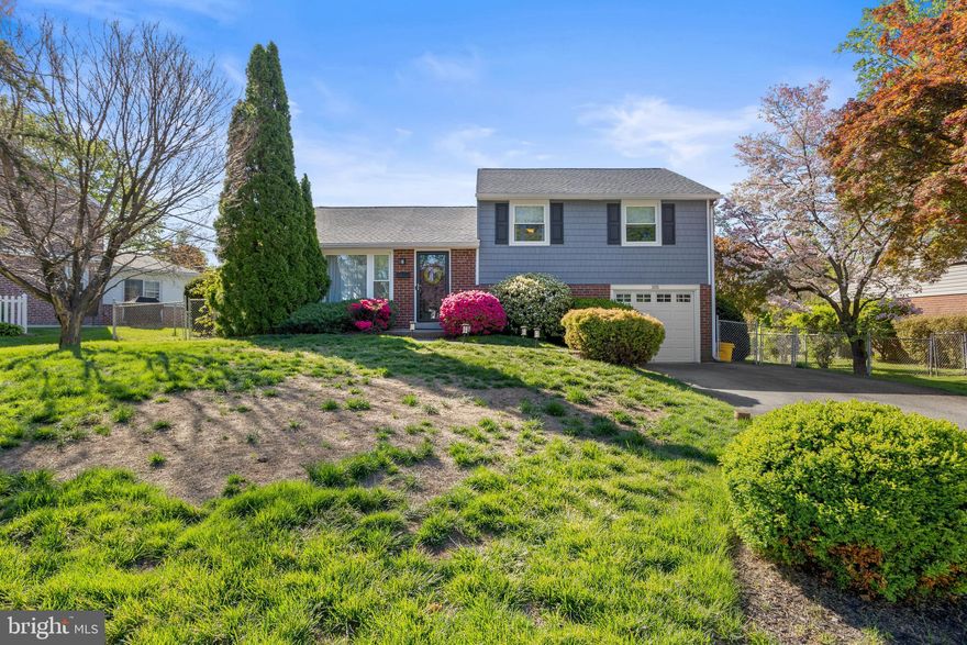 Incredible opportunity in the heart of Springfield Township!
This gorgeous 3-bedroom, 1.5-bath brick split-level is in excellent condition and sits on a perfect lot in one of the prettiest neighborhoods that Springfield has to offer.

Pull down the tree-lined street and into your private driveway. Walk up the side path, past the vibrant azaleas, and into the main level:

Main Level:
Hardwood floors run throughout the living and dining areas. The dining room and kitchen have been opened up into one large, inviting space—featuring dark walnut shaker-style cabinetry, granite countertops, a tile backsplash, stainless steel appliances, recessed lighting, and more. The kitchen/combo area flows right into a covered, screened-in porch that overlooks the private, fenced-in backyard. A deck is located just off the screened-in area, perfect for entertaining or relaxing.

Upper Level:
Hardwood floors continue through all three perfectly sized bedrooms. Neutral tones throughout, with custom wainscoting in bedroom three. An updated hall bathroom completes the upper level. Attic access is available through the hallway closet.

Lower Level:
Cozy family room space with access to the one-car attached garage. Toward the back, you'll find the utility/laundry room with extra storage and a convenient powder room.

Additional Upgrades Include:
15 windows replaced (2022), garage door (2022), new roof and siding (2025), HVAC and water heater (2023), fresh paint (2021), and driveway (2023).

Local Vibes:
Walk to the Dairy Cottage or Springfield Shopping Center. You’re close to everything Springfield has to offer—and just minutes from major highways. Yet, this home still feels tucked away in a quiet, private neighborhood.
