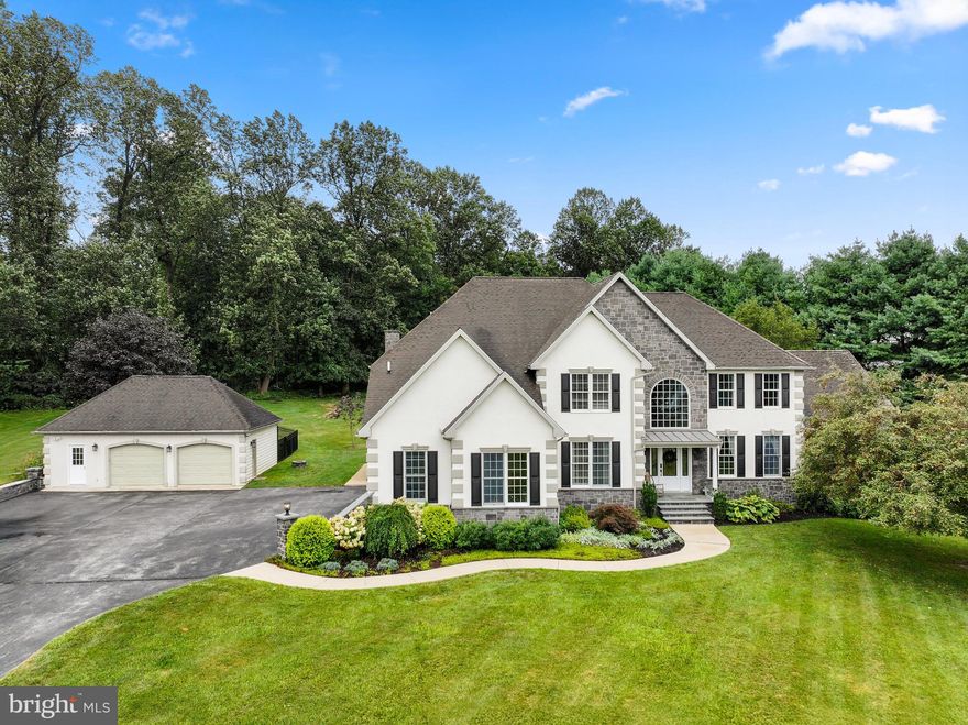 Welcome to this stunning 4 bedroom, 4 1/2 bath,  2.4 acre Beacon Hill gem with walkout in-law suite in the lower level.  Winding down the lane, one is met with serenity at every turn. This is a car collectors dream home with 3 car oversized attached garage and an additional 2 car boasting extra storage and a custom kennel with heated whelping den, outside access, and fenced in area--great for breeding/raising dogs. Walking to the front door, one will notice the extensive natural stone work that accentuates the homes beauty. Have peace of mind with stucco that was treated with lifetime sealer at the end of 2019. Entering the front door one will find an expansive lobby with one of two staircases in the home. To the left is a large office/bonus room. To the right is the dining space that is perfect for hosting. The dining space is connected to the breath-taking family/game room with natural light flooding every corner. Dream of all the guests one can host as you enter the kitchen, one will notice the large kitchen island with breakfast bar. Enjoy plenty of counter space for cooking and baking. The kitchen flows directly into the living room with lofty coffered ceiling and stone fireplace. Up the second staircase, one will find the master suite with walk-in closet and upgraded master bath with jetted tub. Down the hallway three more bedrooms and two more bathrooms await you with great closet space. In the lower level, many surprises await. One will find two spacious bonus rooms with large bath and kitchenette. Open floor plan with massive living space as the focal point. Tons of storage in the utility space of this level makes seasonal decor changes easy.  Don't delay! Make this one of a kind custom home yours! NOTE: Septic system just replaced at the beginning of September 2025.