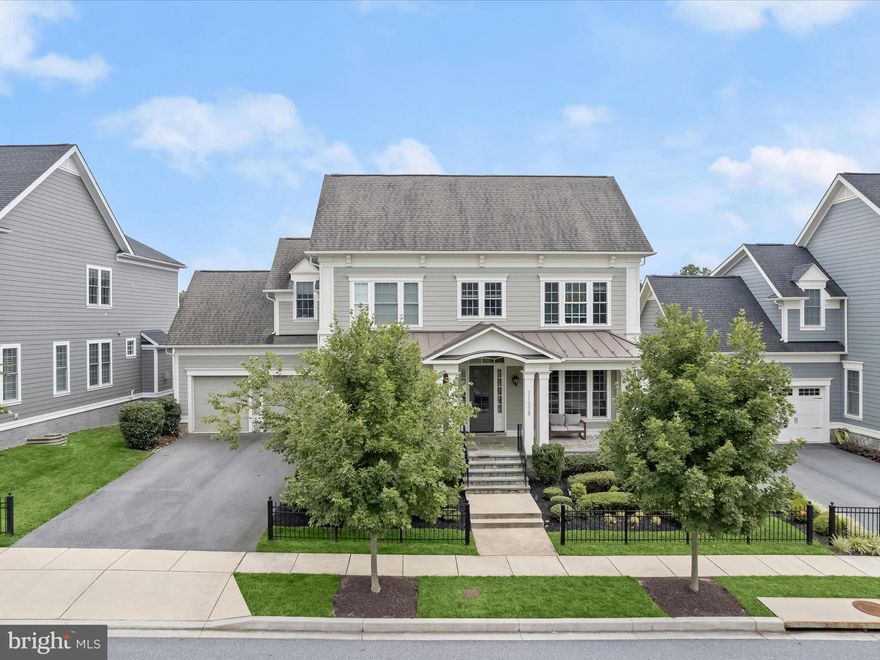 Welcome home to 11539 Iager Boulevard in Howard County’s most sought-after community: Maple Lawn! This fully loaded stunner by esteemed builder Mitchell & Best is located in Maple Lawn’s exclusive Garden District. Featuring the ever popular Hamilton II floorplan, this premier Maple Lawn offering is a benchmark of refined quality, style and taste. Highlights include the sprawling TREX deck, walk-out basement, bright white chef’s kitchen, custom window treatments and an expansive back yard which backs to conservation area. Lots like this one are a rare find in the neighborhood. 

Meticulous landscaping and a full-width flagstone front porch invite you inside the main level. A magazine-worthy kitchen awaits with shaker-style cabinetry extending to the ceiling, double ovens, 6-burner cooktop and eat-in kitchen area. The kitchen is connected to the formal dining room by the functional and beautiful butler pantry. The formal living room boasts a stone gas fireplace and large windows allowing a pristine view of the nature preserve outside. 

A large sitting area greets you at the top of the upper level landing. All four spacious bedrooms are located on the upper level and the primary suite features a tray ceiling, recessed lighting and a huge walk-in closet. The primary bathroom boasts two large vanities as well as a lavish walk-in shower and soaking tub. The lower level provides another large family entertainment area with a walk-out sliding door and large windows allowing an abundance of natural light. A gym and an additional full bathroom are also located downstairs. 

This rare opportunity presents the perfect blend of a serene, private, manor-like setting yet you’re still just a short walk from all the conveniences this award-winning, expertly planned community has to offer. Zoned for highly rated Howard County Schools, conveniently located close to all major Baltimore/DC commuter routes, and with enviable amenities including a resort-style community pool, tennis courts, pickleball courts, basketball courts, state-of-the-art gym and more, you’ll quickly see why Maple Lawn is one of the most sought-after communities in the region and why 11539 Iager Boulevard is truly one of its finest, flagship residences.