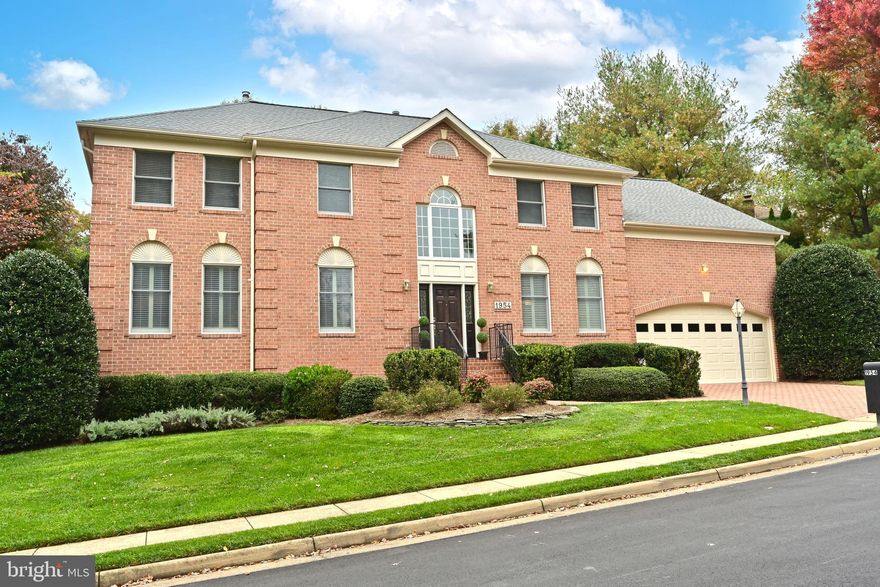 Offering all the convenience of city life in a country-like setting!  1954 Horse Shoe Drive is indeed an urban oasis with its manicured lawns, impeccable landscaping and an enchanting backyard.  Less than a 3-minute drive to Tysons Corner Business District/Mall/Galleria, major and secondary roads, restaurants, grocers and all manner of shops, it is hard to imagine a more ideal location.
Quality-built by Dittmar Company, legendary for their uncompromising quality, this all-brick Manor Home beckons with its driveway of brick pavers and brick walkway.  Owners made careful selections to update living and sleeping areas with upgrades beyond the ordinary.  Totally livable floor plan is spacious and comfortable at the same time, providing many options to work from home, live in comfort and style and entertain with ease.
Builder columns were removed to create a remarkable floor plan, enlarged windows bring the lovely outdoors in year round.  A wall of windows in the Family Room is enhanced with a two-storey stone fireplace, both meeting above at the custom tray ceiling.
Chef's Kitchen has been updated with custom cherry wood cabinetry, granite counters, stainless steel appliances and porcelain floors.  Along the kitchen hallway are closets for much more storage!  At the end of this hallway is the laundry room, complete with its own dog washing sink!
Four bedrooms upstairs include a generous Primary Bedroom with two walk-in closets and a secret storage room.  Primary Bath has been totally updated with handsome cabinetry, granite counters, new tile walls and floors.  Three additional bedrooms are comfortably proportioned--one with its own bath en suite.
The lower level Recreation Room and temperature-controlled wine cellar add another living dimension.  Also on the lower level is an incredible Bonus Room that could be a guest suite with its own refreshment bar and private bath within!  A second Powder Room and large Utility/Workshop with increased electric outlet capacity adds to the thoughtful conveniences in this property.
Grounds are a pure delight with professionally maintained lawns and lovely gardens, powder-coated aluminum fenced rear yard,  in-ground sprinkler system and a rear brick terrace.  This is truly a magnificent property with a Manor House and grounds befitting the most discerning buyer.