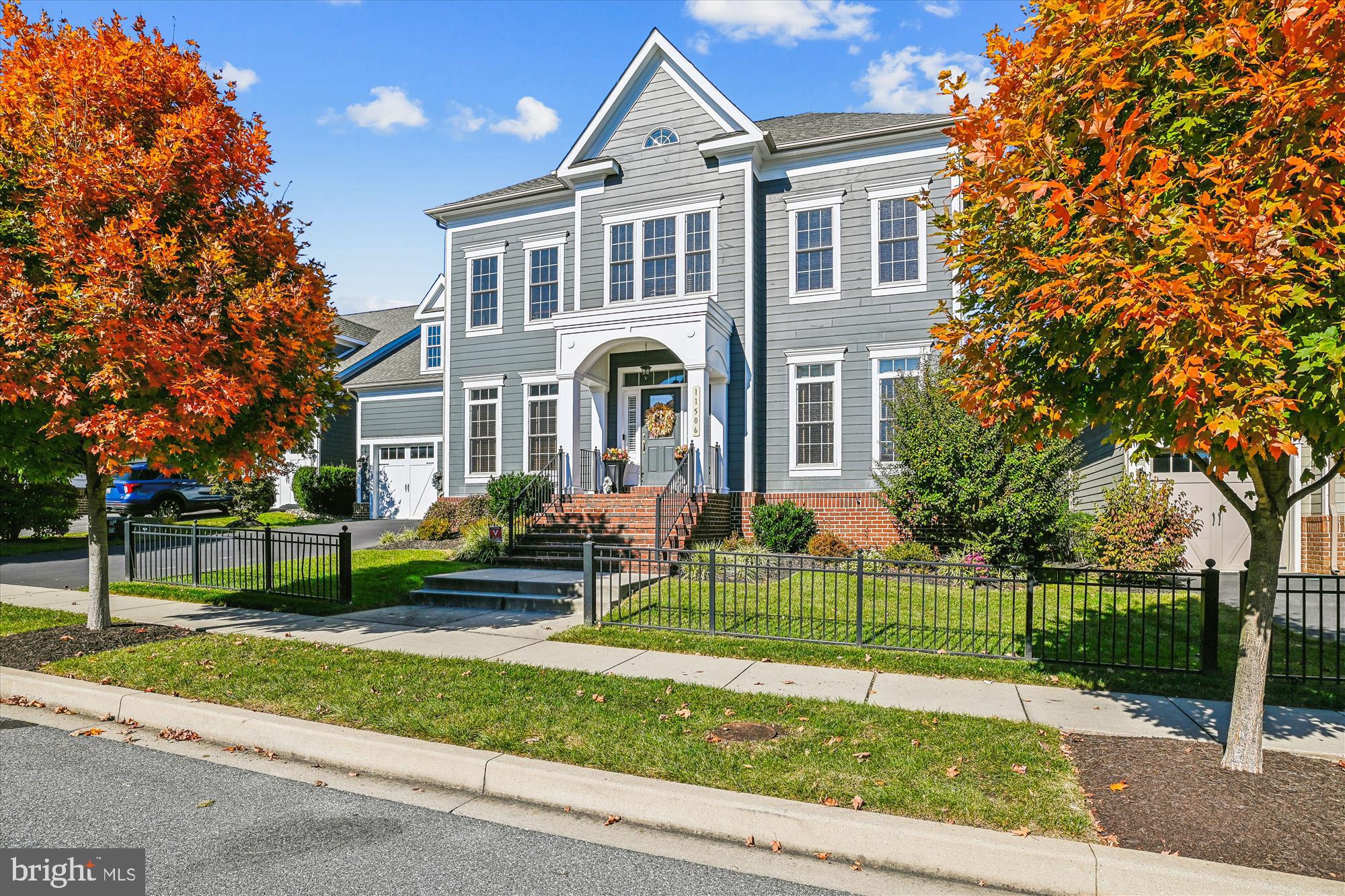 Welcome to this Beautiful Brightwood model home built by Williamsburg Homes, located in Maple Lawn, one of Howard County’s most desirable neighborhoods. Enjoy more than 6,000 sq. ft. of luxurious living space featuring 10 ft. ceilings on the main level and picture framed doorways. The sun-filled foyer is flanked by an office on one side and formal dining room, featuring accent molding and beautiful hardwood flooring, on the other. This house has a gracious design which is ideal for entertaining. The gourmet kitchen includes Kitchen Aid Stainless Double Wall Ovens, 42” Built in Refrigerator, 36” Gas Range and Custom Hood with upgraded Blower are all surrounded by Maple Cabinets and Quartz countertops. The kitchen includes a large entertainer’s Island under stylish pendant lights, a breakfast area, and a Butler’s Pantry. Off the kitchen there is a spacious mud room with built-in cubbies for storage and a chef’s pantry. The Kitchen also opens up to a Great Room with a built-in bookcase and a 42” Gas Stone Fireplace. The lovely Sunroom is just off the Great room on the main level for you to relax in and offers access to the Trex deck and a spectacular Stone Patio and Fire pit in the backyard. Also on the main level there is a beautiful oak tread staircase that leads you to the upper level with 9 ft ceilings and a beautiful Owner’s Suite which features an impressive tray ceiling, two large Walk-in Closets and En-suite Luxury Bath with a Soaking Tub, dual vanities and separate shower with seating and decorative tile inlay. Also on this level you will find another sizable bedroom with its own En-Suite Bath, plus two additional Bedrooms, a Hall Bath, and a Laundry Room. The large lower level offers 9 ft ceilings here as well, Recreation Room with walk-up access to the Backyard, another Full Bath, and abundant Storage space which could easily be converted into more living space, such as a home gym or a media/game room. The fenced backyard has been professionally landscaped with outdoor lighting and a underground sprinkler system. The Maple Lawn Community offers you lots of amenities such as a swimming pool, clubhouse, sports courts, tot lots, and more, with nearby shopping, dining, and entertainment options and is located conveniently to Baltimore, Annapolis and Washington DC. A Must See!