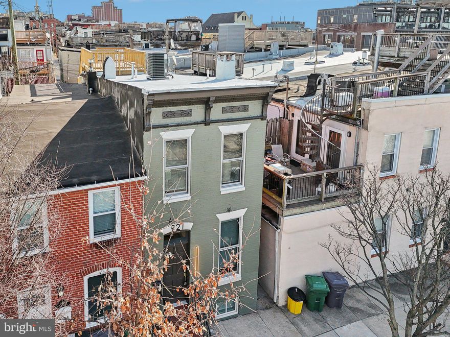 FINAL CHAP APPROVED  - Welcome to your new Pinterest-worthy paradise!
If you’re tired of the cookie-cutter homes and want something with character, this is the one. As soon as you walk through the door, you’ll be greeted by beautiful warm wood floors, stylish dark accent trim, and a pop of green that will make you feel like you’ve stepped into a living, breathing design magazine. This home combines classic charm with modern efficiency, so you can have both the space you want and the style you deserve. Step outside, and you're just one block away from the heart of Canton Square, where you’ll never run out of fun things to do or places to eat. A few blocks further, and boom—waterfront views are yours. On a clear day, you can even see the water from your front porch (hello, breezy mornings with coffee! 
But the real showstopper? The three outdoor entertaining spaces. Need to host a party? You’ve got options. Start with the cozy covered patio on the main level, move up to the private deck on the bedroom level, or take it all the way to the top to enjoy killer views of the Baltimore skyline. No matter what level, there’s plenty of room to make memories. Don’t wait! Schedule your showing today—your new, unique, and totally Instagrammable home is waiting.