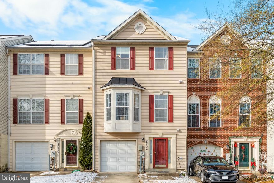 Available February 1st, this meticulously maintained 3-Level, 1-Car Garage Townhome  offer 3 generously sized bedrooms, a bathroom on every level, 2 living spaces, and many upgrades!  As you walk in, you are greeted by a large foyer complete with a coat closet, powder room, inside access to your garage, as well as a spacious rec room with bump out, perfect for an office space.  As you head on up to the main level, you enter a light-filled living room with a bay window, off of which you will find another powder room, and then off the living room is a lovely kitchen complete with 42" cabinets, granite countertops, under-mount stainless steel sink, double wall ovens, island with downdraft cooktop, coffee bar, and a large walk-in pantry!  The kitchen transitions into your dining area with a bonus sitting room, gas fireplace, and access to your outdoor deck area.  On the bedroom level you will find a hall bath accommodating the secondary bedrooms, a linen closet, as well as a primary suite with 2 walk-in closets and an ensuite bathroom.  The bathroom boats a luxurious soaking tub, separate shower, double vanities, and lots of counter space.  Additional features include recessed lighting, ceiling fans, skylights, in-suite washer and dryer, video doorbell, and an EV Charger in the garage!!  Steps to the playground and lots of overflow parking, with community amenities consisting of an outdoor pool, gym facility, and sports courts.  Conveniently located within minutes of Fort Meade, with easy access to major commuter routes, and central to Arundel Mills, Annapolis, Baltimore, and DC.