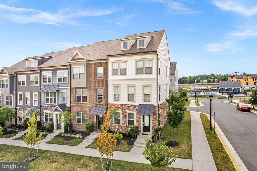 Welcome to this like-new end unit townhome boasting with natural light! 4 bed, 3.5 half-bath spanning across 2,016 square feet on an open-concept floorpan! Walk into the spacious entryway either through the front door or your two-car rear-load garage and you'll find a bedroom with brand new carpet and a walk-in closet, full bath, and coat closet. As you walk up, you'll notice beautiful oak staircases and brand new luxury vinyl plank throughout, other than bedrooms, and fresh paint throughout the home. Your large kitchen features a 9' kitchen island with  quartz countertops, upgraded stainless steel appliances, and plenty of cabinet space. The spacious dining room leads seamlessly to your low-maintenance deck with Trex railings for entertaining perfection, and here you will also find your half bath and large, walk-in pantry. Imagine relaxing in the airy family room with fabulous windows that allow for the natural light to soar through! The third level features a luxurious primary bedroom suite with a walk-in closet, a primary bath with dual vanity sinks, and a stand-up walk-in shower with a bench. The laundry room is located in the hall by the master, making laundry day a breeze! Two additional bedrooms are situated across the hallway and share a full bath with a tub. This home is situated on an incredible lot facing the largest green space in the community with no obstructing views! Community amenities include a pool, tot lot, clubhouse, and pickleball courts. The nearby W&OD trail makes this great for bikers and hikers. Right off of Route 7, this fabulous home is walking distance to The Villages of Leesburg and its shops, restaurants, and entertainment. Five minutes to Downtown Leesburg, a quick two minute drive to the Leesburg Outlets and shopping centers, and less than ten minutes to One Loudoun make this location ideal for you!