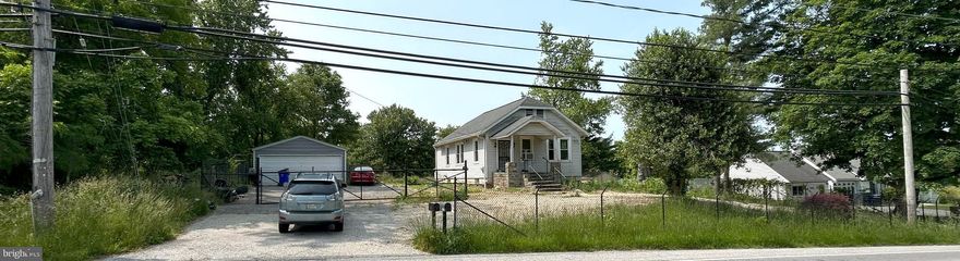 List price to be opening bid.  Online auction to be conducted on Auctioneers website. Bidding begins Saturday, June 10th & ends Thursday, June 15, 2023 at 11:30am.  A/K/A 9745 State Route 99, Ellicott City, MD 21042. A great opportunity to purchase a detached single family house in Ellicott City, on .76+/- acres with a 2 car detached garage.  Also behind the house there are 2 small structures surrounded with stone, a manufactured home on concrete blocks, and a wood shed. The house is in need of updating and some renovation.  The main house has 2 bedrooms, 1 bath, living room, dining room and kitchen on the main level. The lower level is unfinished and includes the mechanical systems for the house, water system, oil tank, hot water heater, forced hot air heat, and storage area. There are stairs up to the attic, that is unfinished.  Features • The front of the house has a small covered porch. • Wood type floors in the main house • Propane tank probably for the stove • Multiple detached sheds • A partial fence in front of the property • Off street parking in front of the property • A screen door on the front door • On a well and septic.  Location: The property has a convenient location in Howard County near dining, shopping, schools, recreational facilities, and access to transportation routes.  Route I70 & I29 are nearby and offer access to Baltimore & Washington DC.