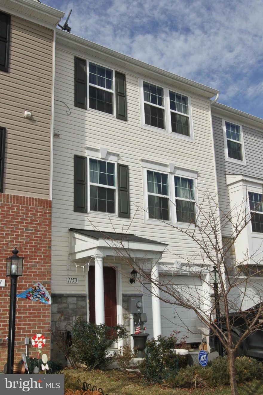 A like-new 3 bedroom townhome with no wait! This conveniently located Fairfax Crossing townhouse features an open kitchen with cherry finished cabinets, newer black appliances, and a large island with a view to the back deck and yard. The large living room features stained bamboo flooring. finished basement and attached garage too! Master bedroom has attached bath and walk-in closet.