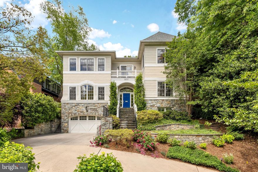 Sited on a tree-lined street in Kent, 5017 Klingle St NW presents a masterfully built home by premier builder Chryssa Wolfe of Hanlon Design Build, offering the perfect blend of luxury and functionality. Boasting 6 BR, 5.5 BA, and 7,700 Total SF across 3 Levels, the residence showcases incredible interior scale with soaring 9’10” Main Level ceilings and expansive entertaining areas, while an outdoor oasis boasts a private swimming pool and a fully fenced, manicured rear garden with dining patio. The Main Level features an inviting Foyer leading to the spacious Living Room adorned with 12’ ceilings, a formal Dining Room, a Study, and a Powder Room. A Gourmet Kitchen, outfitted with a walk-in Pantry, lengthy island, coffered ceiling, top-of-the-line Sub-Zero, Wolf, and Miele appliances, flows effortlessly to the sun-filled Breakfast Area, Family Room, and Office. The Family and Breakfast Rooms provide direct access to a large, covered porch, rear patio, and private swimming pool. The Second Level hosts 5 Bedroom suites and 4 Full Baths, including a luxurious Primary Suite, a convenient Laundry Room, and a south-facing balcony. The luxurious Primary Suite features two walk-in closets, a private balcony overlooking the rear yard, and a spa-like Bath complete with a soaking tub, dual vanity, and walk-in, curbless shower. The Lower Level offers access to the attached 2-Car Garage, a large Recreation Room with a wet bar and fireplace, and a Gym Area. A 6th Bedroom with a walk-in closet, a Full Bathroom, and a Storage/Utility Room complete this level’s offerings. Located in Kent, 5017 Klingle St NW, offers prime proximity to DC’s restaurants and retail, and is zoned for Key ES, Hardy MS, Jackson-Reed HS. Battery Kemble Park, Glover Archbold Park, Palisades Recreation Center, Sibley Hospital, and American University are all close by.