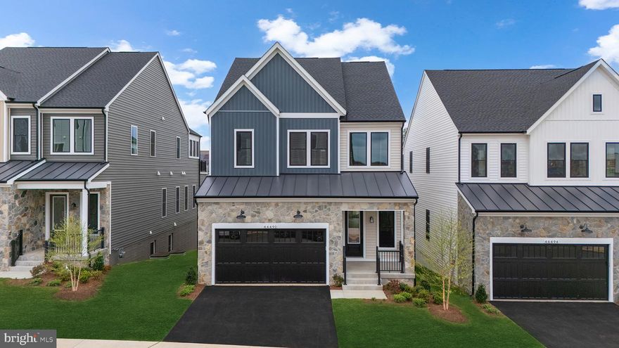 Say hello to your new dream home! This brand new incredible ACTIVE ADULT (55+) SINGLE FAMILY HOME by Van Metre Homes at LEXINGTON SQUARE is ready to move in IMMEDIATELY! The SCOUT 30-F2 floorplan is a masterfully engineered home offering over 4,100 square feet of finished elegance across 3 levels featuring 4 bedrooms, 3 full and 1 half bathrooms, and a 2-car, front-load garage, providing ample space for your personal lifestyle. As sunlight floods through expansive windows, the main level welcomes you with soaring 10' ceilings and a sophisticated open floorplan, crafting an inviting and spacious atmosphere ideal for both unwinding and maximizing productivity. For those who love to entertain, the heart of the home awaits in the signature gourmet kitchen, boasting an oversized center island, upgraded cabinets, quartz countertops, stainless-steel appliances, and luxury vinyl plank flooring. Whether you're hosting intimate gatherings or preparing family feasts, this space caters to your every culinary need. The main level primary suite features a chic bathroom complete with an oversized frameless shower featuring a built-in seat, ensuring relaxation after a long day. Ascending to the upper level, two additional bedrooms await alongside a fabulous flex/retreat space, offering versatility to your space. Enjoy a finished basement complete with another bedroom, bath, and additional storage to support your unique lifestyle. But that is not all! Picture yourself soaking in breathtaking sunsets and entertaining guests on the stunning covered roof terrace! Being a new build, your home is constructed to the highest energy efficiency standards, comes with a post-settlement warranty, and has never been lived in before! Don't miss the chance to experience the height of contemporary living in the SCOUT 30-F2 floorplan. Schedule an appointment today! ----- Located in Northern Virginia, Lexington Square is an Active Adult (55+) community that offers townhomes and spacious single-family homes. Residents benefit from its close proximity to One Loudoun’s restaurants, shopping, movies, and community events. With just 23 homes, this small and intimate community offers the perfect balance of privacy and convenience, allowing you to enjoy your own space. The neighborhood is complete with a bocce ball court and walking trail, along with a gym membership for the first year at Method Health Club just steps away. Additionally, Lexington Square’s convenient location places it close to the Metro’s Silver Line, Dulles International Airport, commuter routes, and health centers, making it a prime destination for those seeking a well-connected and vibrant lifestyle. ----- Take advantage of closing cost assistance by choosing Intercoastal Mortgage and Walker Title. ----- Other homes sites and delivery dates may be available. ----- Pricing, incentives, and homesite availability are subject to change. Photos are used for illustrative purposes only. The community lies within the Airport Impact Overlay District. Due to its proximity to Dulles International Airport, this site is subject to aircraft overflights and aircraft noise. For details, please consult the Community Experience Team.