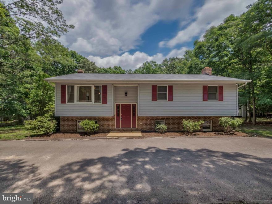 CLEAN SPLIT FOYER! 4BR 3 BA well taken care of, kitchen boasts of cherry cabinets and s.s. appliances. Large deck off dining area, Sprawling partially fenced backyard. Huge detached 8+ car garage is awaiting your finishing touches, great for a mechanic or a home based business. Over 1.5 acres close to the heart of Leonardtown. Country living with city conveniences. Set your appointment today!