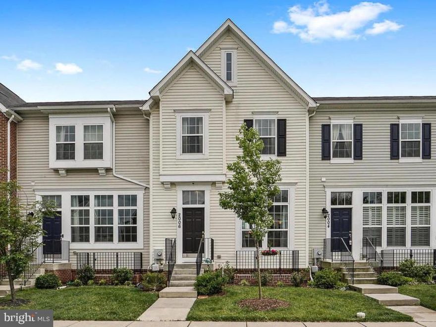 This immaculately maintained town home shows like a model! Completely move-in ready! The open concept floorplan features a light-filled living area with gleaming hardwood floors. Enjoy cooking and entertaining in the gourmet eat-in kitchen with a spacious center island, breakfast bar, granite countertops and stainless steel appliances. Plus, a bonus wall of cabinets for extra storage! Work at home from the convenient main-level office area off the kitchen with two granite desk areas and plenty of cabinetry for home office storage. Walk out to the large deck perfect for your morning coffee. On the upper level, the Owner s Suite has two walk-in closets and a spa-like bath with upgraded tile shower and separate sink areas. Plus two more upper level bedrooms and a full bath. The lower light-filled level features a  recreation area and a huge bedroom plus a full bath! This fantastic home is a must see. It won t last long!