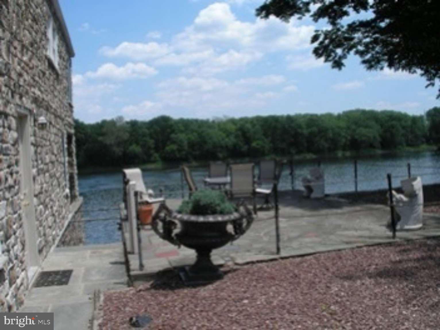Large completely renovated 2000 plus sq.ft. Condo with fantastic River Views & access to Boat House/Boat Slip with Private River accessibility. All units high efficiency heat pumps, public water and sewage, hardwood floors, 2 stone fireplaces, 3 Bedrooms, 2 Baths. Eat-In Kitchen with updated appliances, Sun Room/Office, Washer/Dryer, Half Basement Storage, Off Street Parking for 2 cars , Private Entrances. Wood Burning Stove. Recently Painted. Patio. NON-SMOKING . Rent $2,390/ Month plus utilities