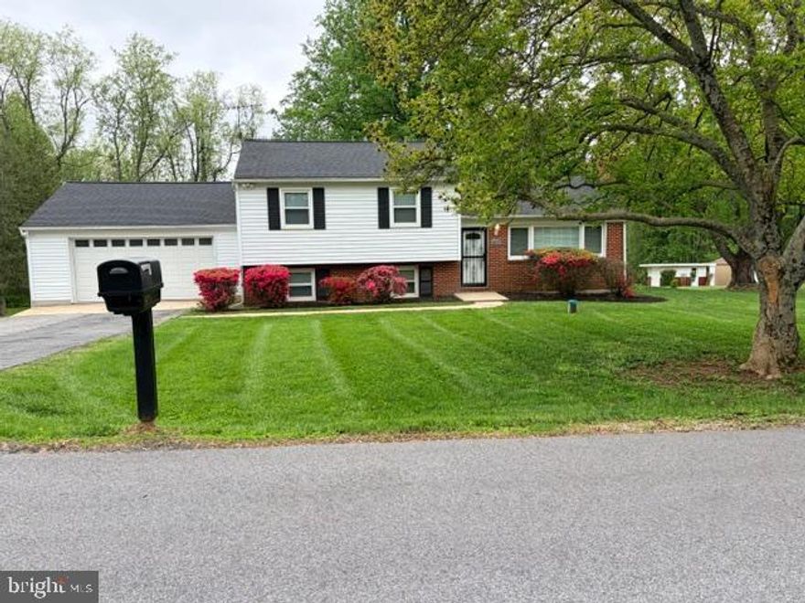 Fall in love with this expansive single family split-level home with a 2-car garage, approximately 2300 square feet, that features THREE (3) BEDROOMS and TWO (2) FULL BATHS, along with a spacious basement area and nice walkout patio that overlooks a large beautiful backyard in the picturesque and charming WINDSOR MILL COMMUNITY in Windsor Mill, MD.  Boasting the distinction of being one of the largest homes in the development, this residence sits on a 23,958 sq ft lot (0.55 acre) and offers an opulent blend of space and style.  With multiple bedrooms and bathrooms, this home unfolds with triple levels, offering an abundance of living space for your family's needs.  Gleaming hardwood floors in the living room and a timeless neutral color palette create an inviting ambiance that welcomes you home. The journey begins with the sun-drenched living room, leading you to an elegant dining room and a meticulously designed kitchen.  This culinary haven features a peninsula island with bar seating, beautiful quartz countertops, stainless-steel appliances, and a separate dining area. On the upper level, three (3) generously sized bedrooms await, providing ample space for rest and relaxation.  The home has undergone a comprehensive top-to-bottom modernization, leaving no detail unattended.  Designer accents, including recessed LED lighting, plush carpet, and a fully redesigned basement with plush new carpeting, enhancing the overall aesthetic.  Step onto the exterior patio, a true gem that seamlessly provides outdoor serenity.  Large windows grace the front of the residence, allowing natural light to flood the space.  A recently installed HVAC system and water heater ensures comfort and efficiency. Descending to the lower level, you'll discover an expansive recreation or living room space which also includes a convenient laundry room, and a well-appointed bathroom. This space can even be used for a daycare or business venture, with its own private entrance. Practical storage options are available in the basement, while a sizable shed in the backyard offers space for outdoor equipment and more.  Positioned at the intersection of Windsor Mill, Randallstown and Woodstock, this property provides a harmonious blend of tranquil suburban living and convenient access to urban amenities. Major thoroughfares like I-695 and I-795 and Liberty Road are within easy reach, streamlining your commute.  Don't miss the opportunity to make this remarkable residence your own.  With its generously proportioned layout, modern features, and desirable attributes, it offers a comfortable and spacious living experience.  Act swiftly to schedule a visit and secure your place in this exceptional home, as it is sure to find its new owner in no time.  Your dream home awaits! Seller prefers Assurance Title LLC (Columbia, MD) for title/settlement. Please write offers accordingly.