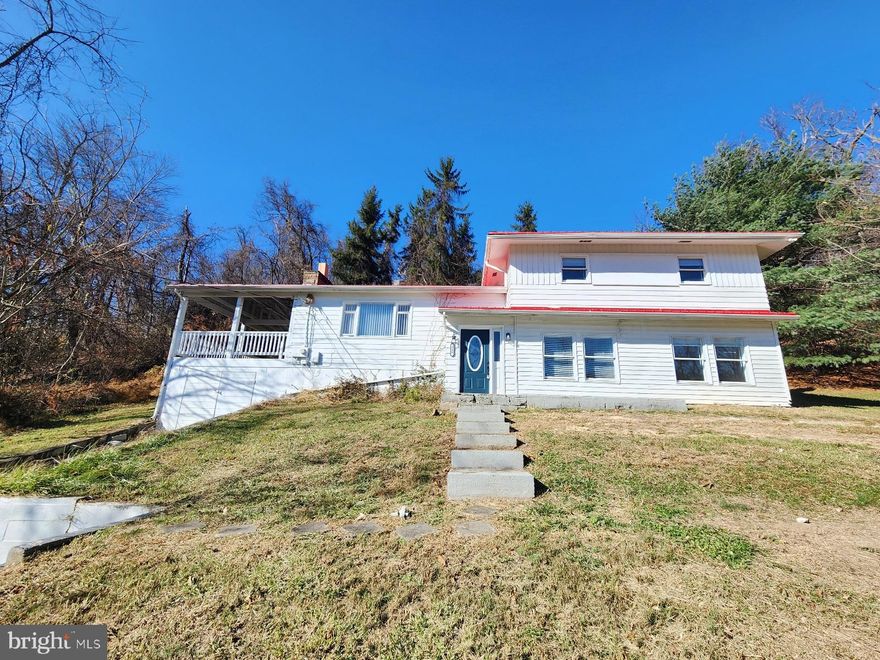 Beautifully Remodeled 4-Bedroom Home on a Quiet Dead-End Street with Mountain Views!  If you’ve been waiting for a move-in ready home in LaVale that needs nothing—this is the one. Fully remodeled, beautifully updated, and perfectly positioned on a quiet dead-end street, this 4-bedroom, 2-bath split-level offers the comfort, space, and modern finishes buyers want without the hassle of a fixer-upper.  Peaceful Setting & Gorgeous Mountain Views!  Enjoy quiet evenings and relaxing mornings taking in the scenery from your covered side porch—your own private outdoor retreat.  Step into the bright living room featuring a cozy wood-burning fireplace, perfect for fall and winter nights.  Stunning Kitchen with Quartz Countertops.  The large eat-in kitchen offers quartz counters, a convenient dining area, and appliances that convey. Functional, stylish, and ready for everyday meals or gatherings.  Flexible Layout with Main-Level Bedroom/Office!  The main level gives you options—office, guest room, or fourth bedroom—plus a separate laundry room and spacious family room.  Updates include:   New laminate plank flooring,  Metal roof, and  Updated finishes.  Move-in ready top to bottom!!! Convenient Parking & Storage!  Attached 1-car garage + driveway parking.  Prime LaVale Location!  Close to medical facilities, library, restaurants, shopping, and commuter routes. Peaceful setting without sacrificing convenience.  Call today to schedule a tour!