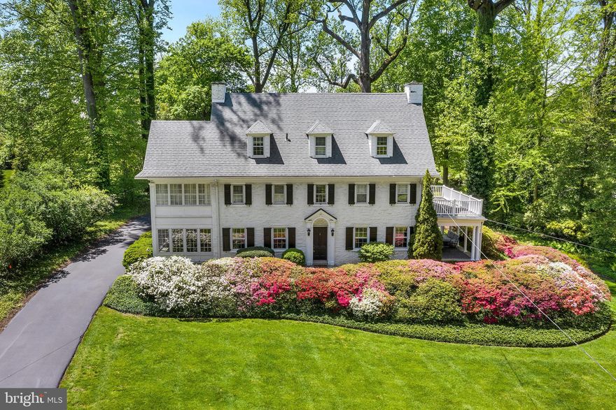 This turn of the century stone colonial is reminiscent of a bygone era and incorporates old world charm with a new vision of youth and vitality. A vibrant Center Hall leads to a fireside Living Room which is enhanced with extensive molding and French Doors leading to a Covered Porch and wrap around Deck perfect for summer entertaining. The formal Dining Room with characteristic frame molding is bounded by an enclosed sun porch/office. A bright, updated kitchen, accented with quartz countertops, cooking island and stainless steel appliances is located at the heart of the home and is central to a Family Room with a gas fireplace, vaulted ceiling, skylights, and a separate Breakfast Room with wet bar and wine cooler. The stairway to the second floor is graced with a landing and large window allowing the sun to stream in through the elegant Center Hall. The Second Floor has a Master Bedroom and attached Bathroom, and access to a sitting/dressing room, with custom built-ins and an abundant amount of natural light.  Completing the second floor are 3 additional bedrooms and a hall bath. The Third Floor has 3 additional bedrooms and 1 renovated bathroom providing a private space for Au pair, in-law or guest suite or an additional family entertainment area. The newly finished lower level includes a Powder Room and Laundry and makes for a perfect getaway for teenagers, parents or toddler play. This stately home sits on a one-acre lot surrounded by beautiful mature plantings.  Located in the award winning Lower Merion School District, this home offers easy access to the train line, universities, major highways, restaurants, shops and parks.  Truly an incredible opportunity to live on one of the most desirable streets and enjoy all the Main Line has to offer.