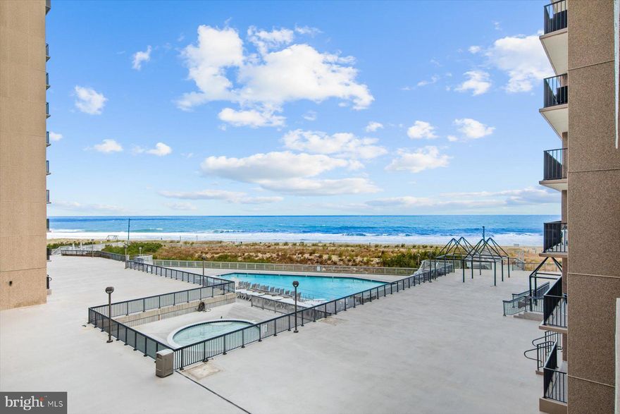 Wake up to the coast in this oceanfront condominium, offering a generous 1,175 sq. ft. floorplan located in the sought after and rarely available Island House.  Presenting 3 spacious bedrooms, 2 full bathrooms and desirable North Eastern exposure, this residence welcomes spectacular morning sunrises, presenting soft natural lighting throughout. The open floorplan flows with ease, complemented by engineered hardwood flooring. Expansive sliders showcase dramatic views of the Atlantic and the oceanside pool, filling the living spaces with a gentle coastal glow and creating an inviting atmosphere. A coastal red, white, and blue décor and thoughtfully chosen furnishings enhance the home’s seaside character, while the open contemporary kitchen features a wainscot ceiling, glistening white Quartz countertops, cushion-close cabinetry with a glass-doored entertainment section, stunning backsplash tile, a ceramic farmhouse sink, and stainless appliances—all seamlessly integrating with the dining area, perfect for entertaining or casual gatherings. Additional upgrades include all new interior doors, space-saving pocket doors, a Trane HVAC system (2019), and a hot water heater (2023), adding both style and functionality to the home. The oceanfront primary suite offers serene water views and boasts a gorgeous tiled walk-in shower, upgraded flooring, and custom built-in cabinets, creating a true retreat. The guest bathroom is equally impressive, upgraded with a glass-door tub/shower, vanity, and tile flooring, providing comfort and style for family and visitors alike. Step onto your private balcony to enjoy the tranquil sounds of the waves and ocean breezes. Blending upgraded finishes, soft natural lighting, and dramatic oceanfront views, this condominium delivers the perfect balance of comfort, style, and coastal lifestyle. Stroll the half-mile promenade along the lifeguarded beach with 5 outdoor heated pools and an indoor pool and fitness center. You will also have full access to Sea Colony West amenities including a state of the art Fitness Center with indoor and outdoor lap pools, oversized cardo workout center, Peloton bikes, exercise and yoga classes and more with a caring staff. Choose from 30 outdoor tennis/pickle ball courts or play in the USDA ranked indoor tennis center year round. Sea Colony is the best place to be for summer and year round enjoyment.