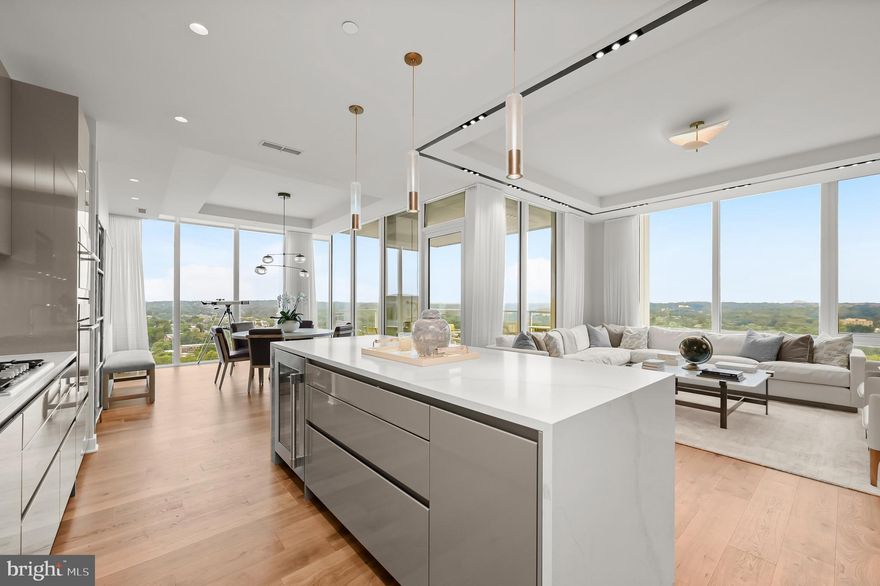 Experience the epitome of elevated urban living at The Pierce.  This luxury condominium is located in a striking, 27-story building and features an array of premium amenities that ensure comfort and convenience. This property offers approximately 2400 square feet of living space to cater to your every need.
Step into Unit 2401 via your private elevator.  An open floor plan seamlessly integrates each living area with hardwood flooring throughout. The chef's kitchen is outfitted with top-of-the-line Thermador appliances and ample counter space, gas cooktop, built in microwave, Snaidero cabinetry, quartz countertops with waterfall island, and wine refrigerator. This residence boasts three spacious bedrooms equipped and two and a half baths with high end marble finishes.
One standout feature of this property is its breathtaking views. From your private balcony, marvel at stunning panoramas of the Potomac River and Georgetown—elevating your daily living experience. 
Beyond the walls of this stunning home, you'll find shared amenities designed to enhance communal life. Enjoy a dip in the rooftop pool or keep fit in the state-of-the-art, two level fitness center available round-the-clock. The rooftop club room offers a great venue for social events while outdoor dining options provide opportunities for alfresco meals against beautiful cityscape backdrops.
Built in 2021, this modern condominium also includes two designated parking spaces—an added benefit in such a prime location—and round-the-clock concierge services offering assistance whenever needed.