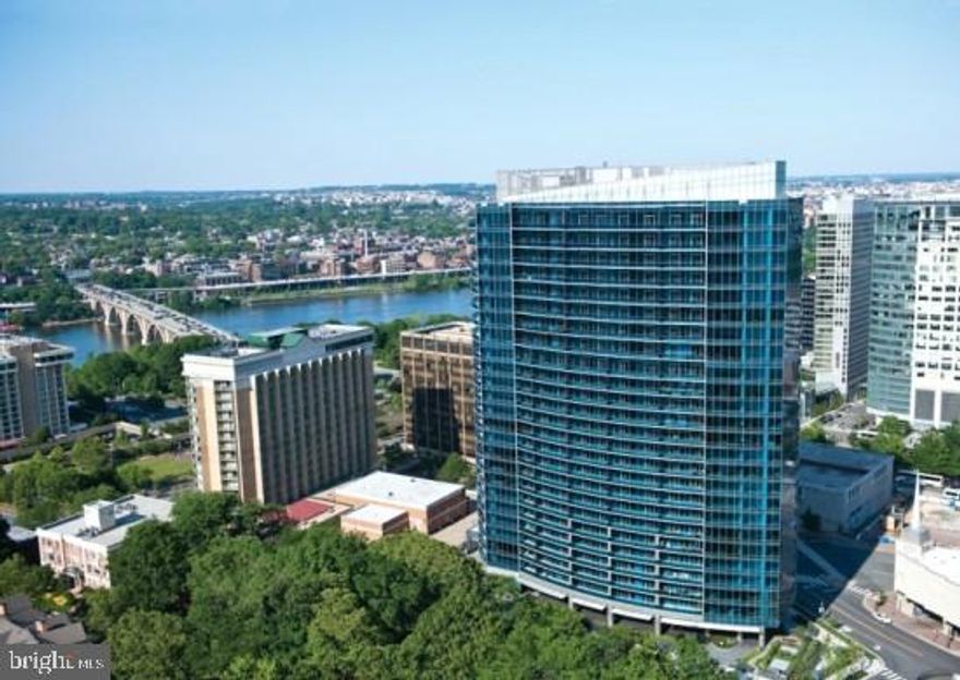 Perched atop Rosslyn's skyline as the highest residential building in the Capital Region, Turnberry Tower redefines upscale urban living. Occupying the prestigious Tower Suite #2, this uppermost condo boasts private elevator access, 11-foot high ceilings, and an unobstructed, breathtaking panorama that includes the Potomac River and stunning sunsets, unaffected by recent constructions. The grand open layout is accentuated by automated floor-to-ceiling windows and an expansive private terrace that offers an endless visual feast, free from the shadows of new buildings.An elegantly designed reception vestibule opens into this airy space, seamlessly blending the living and dining areas for sublime entertaining. At the center of this haven is a gourmet chef’s kitchen, outfitted with top-tier Snaidero Italian cabinetry, granite countertops, and premier Miele appliances—including an integrated espresso machine. Brazilian Cherry hardwood floors enrich the entire suite, enhancing its luxurious feel.The master suite is a sanctuary of sophisticated comfort, featuring a marble fireplace, direct access to the terrace, and a lavish dressing room with custom fittings. The ensuite bathroom is equally opulent, equipped with dual vanities, a Jacuzzi tub, and a separate glass shower. Two additional bedrooms offer luxury and comfort, each with personal marble baths—one with a jetted tub and the other a walk-in shower—and ample closet space.Adjacent to these rooms, a sunlit den serves as an ideal home office or lounge area, its large windows framing the western horizon. The convenience of in-unit laundry with full-sized Miele appliances, two secure underground parking spots, and a private storage unit, enhance the functionality of this exquisite home.Turnberry Tower provides unparalleled services and amenities, including 24-hour concierge and security, complimentary valet, a state-of-the-art fitness center, indoor pool, private cinema, and community social rooms. Located on Rosslyn’s vibrant waterfront, just across the Potomac from Washington's historical landmarks, #TS02 offers an unmatched standard of luxury urban living for discerning buyers.