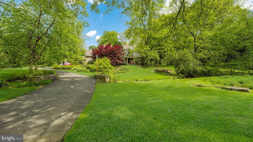 Nestled in Solebury Township, 46 Valley Road is an exceptional property that blends warmth, charm and modern convenience. This special property features 4 bedrooms, 3 full baths, 3 car garage perched on 1.9 acres that has been professionally landscaped and maintained. You’ll also find additional living quarters above the garage with another 2 bedrooms, 1 full bath, generous living areas and an outdoor patio for guests or family. Let’s take the tour through this one-of-a-kind property! Head up the driveway, you’ll notice a blend of Belgium block and bluestone, complemented by a charming carport. The lead walk and front porch continue with bluestone and a perfect setting to enjoy a summer beverage. Step inside to a grand foyer that opens to a cozy family room, highlighted by soaring vaulted ceilings, a stunning woodburning fireplace with a stone hearth, and an abundance of natural light. The formal dining room with breathtaking views out back, complete with French doors leading outdoors, is perfect for family gatherings and celebrations. At the heart of the home lies the updated kitchen, equipped with a spacious center island, stainless steel appliances, a wall oven, warming drawer, microwave, gas cooktop, and stylish tile backsplash. The double sink and additional prep area with a secondary sink cater to culinary enthusiasts. A breakfast nook with a bay window and outdoor access offers a charming spot for morning coffee. Down the hall, you'll find built-in cabinetry for a convenient drop zone, a full bath, a home office, and two generously sized bedrooms. In addition, you’ll find a versatile bonus room with vaulted ceilings, wood beams, windows on all sides, custom lighting and a separate entrance presents endless possibilities. Upstairs, a cozy reading nook offers a quiet escape before leading to the primary suite. This tranquil sanctuary boasts high ceilings, French doors opening to a private balcony overlooking your backyard oasis. The updated primary bathroom offers dual sinks, granite counters, a steam shower with a second large shower stall with frosted frameless glass. The 4th bedroom completes this level. The finished lower level includes a full bathroom, laundry area, and a converted garage space—now a fully equipped gym with mirrors, cabinetry, and durable flooring, ready to accommodate a variety of needs. Step into your own backyard paradise! The heated in-ground saltwater pool offers ample space for lounging and entertaining. A stylish cabana room provides a private outdoor retreat, while lush landscaping, an in-ground irrigation system, landscape lighting, and an outdoor sound system create the perfect ambiance for summer gatherings. The oversized 3 car detached garage (36’ deep x 40’ wide) with new epoxy flooring, heater, slat wall and cabinetry for all your storage & workshop needs. The apartment above, accessible from the garage or a private entrance, offers an open living area, dining space, office nook, and a kitchen with granite counters and stainless steel appliances and a laundry area. Located just moments from New Hope's vibrant downtown, enjoy easy access to boutique shops, renowned restaurants, and cultural attractions along the Delaware River. With its blend of timeless elegance and modern amenities, 46 Valley Road presents a unique opportunity to own a piece of New Hope's rich history while enjoying a contemporary lifestyle.