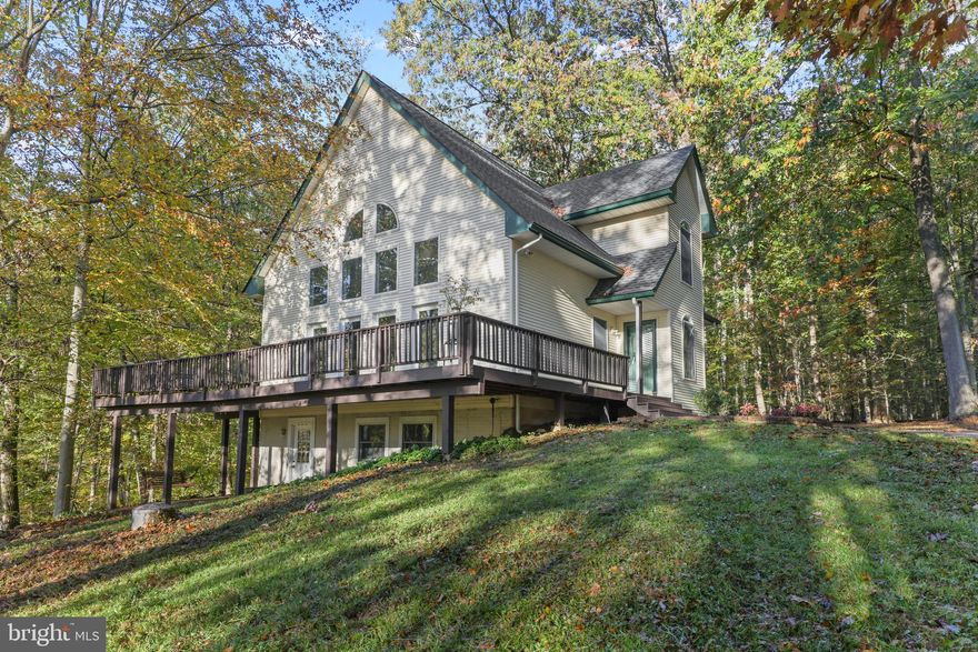 GORGEOUS & WELL MAINTAINED HOME LOCATED ON PRIVATE 2+ ACRE LOT NOW AVAILABLE. AWESOME LOCATION WITH INCREDIBLE VIEWS. TONS OF NATURAL LIGHT. GLEAMING HARDWOODS CASCADE THROUGHOUT. ENJOY CUSTOM CABINETRY, IMPORTED TILE,  SS APPLIANCES IN THE DESIGNER CHEF'S KITCHEN. OVERSIZED FAMILY ROOM WITH CATHEDRAL CEILINGS. LARGE DINING SPACE. SPACIOUS 3 BEDROOMS WITH 2.5 BATHROOMS. AMAZING LOFT ON SECOND LEVEL - GREAT FOR GYM, LIBRARY, PLAYROOM, OR OFFICE. LARGE OUTDOOR DECK WITH WRAP-AROUND PORCH - GREAT FOR ENTERTAINING. UNFINISHED WALK-OUT BASEMENT WITH BATHROOM ROUGH-IN. 1,000 GALLON BURIED PROPANE TANK. CLOSE PROXIMITY TO LOCAL DINING, RETAIL SHOPPING, AND MAJOR HIGHWAYS. SCHEDULE A PRIVATE TOUR TODAY.