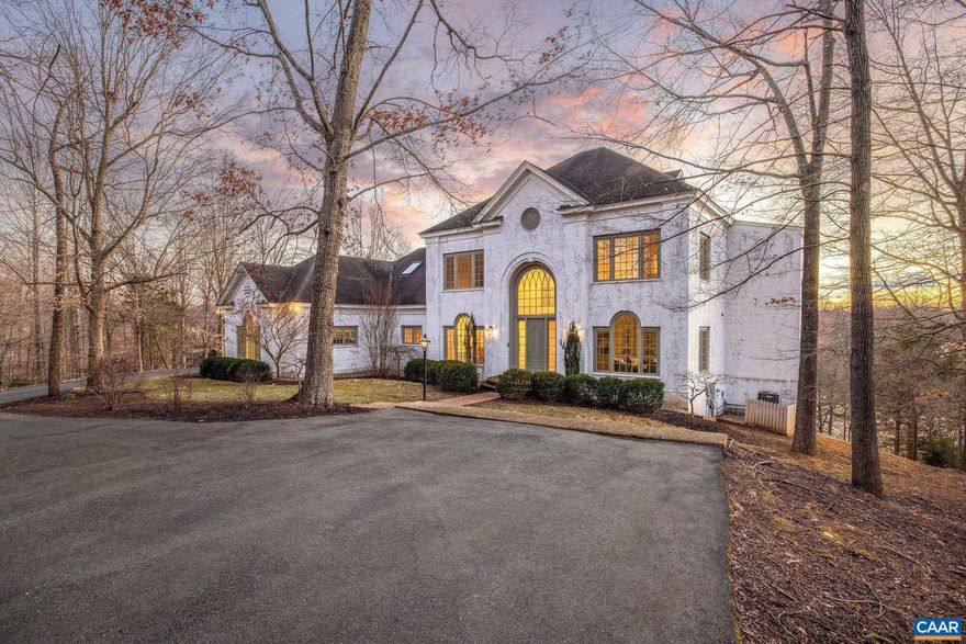 One of the most coveted settings in Glenmore, this 4 bedroom, 5 full bath, and 2 half bath brick home sits on 1.27 acres overlooking the 18th hole of the golf course, the Rivanna River, and Monticello Mountain, offering unparalleled views. From the moment you step inside, you are greeted by a grand staircase, a light-filled office, a spacious dining room, and a newly renovated chef's kitchen designed for entertaining. The upper level features the luxurious primary suite with panoramic mountain views and a beautifully updated primary bathroom. There are two additional rooms with en-suite bathrooms on the second level.The walk-out basement offers a large family room with new flooring, a bedroom with en-suite bath, and a convenient half bath that provides easy access from the pool area. Storage is abundant with large garages on two levels. Thoughtfully designed to embrace its stunning natural surroundings, the home offers exceptional outdoor living spaces, including a screened porch, a private balcony off the primary suite perfect for morning coffee, a main level balcony ideal for sunset views, a pool, and a fire pit for evening gatherings. The purchaser is also eligible for a 25% discount on initiation to the Club at Glenmore.,White Cabinets,Fireplace in Family Room,Fireplace in Master Bedroom