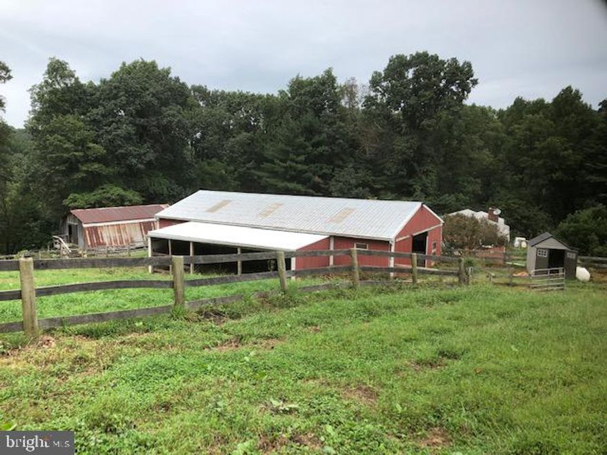 28 Acre Horse Farm is very secluded and private, 1 parcel 2 deeds.  Winter Run  River runs directly through the entire property with full access.  The property boast a Main Barn 60 by 30  w/10 stalls / extra wide matted center you can drive through, LED Lighting on its own electric service., wired for heated buckets.  Bank Barn w/2 stalls (tact room, hay loft , stairs), 2 Riding Rings/upper 60 x 120 , lower 100 x 200,  2 automatic water stations for horses 2 Run in Sheds and fenced in pasture.There is a second adjacent lot, 10 acres, perked lot has already been subdivided for a smaller farm if desired,  You can also build a second home on the 18 Acres for a total of 3 homes on 28 acres.