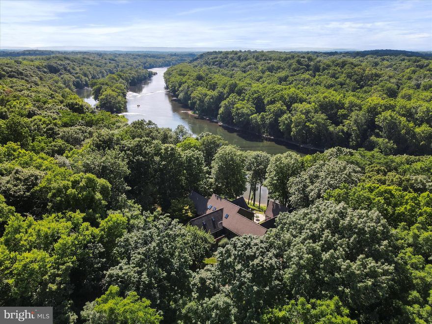 A Timeless Retreat: Tranquil Living on Nearly 10 Acres with River Access
Welcome to a special place where time stands still for a moment! This private retreat, nestled on close to 10 acres of tranquility with your own river access, offers breathtaking views and an idyllic lifestyle.

Scenic Beauty: Enjoy breathtaking views of the river from multiple patios perfect for outdoor gatherings. The meticulously landscaped gardens, exceptional plantings, and mature trees enhance the property's charm, creating a picturesque and serene setting. The gourmet kitchen boasts plenty of counter space for the chef in the family, making it ideal for entertaining.
The home features three bedrooms and two and a half baths. Pella windows frame stunning river views, while a glass-enclosed room with a heated tile floor and screened-in porches offers year-round enjoyment.
The stone patio provides a perfect spot to unwind, listening to the soothing sounds of the river meandering past. Shaded trees weave along the driveway, adding to the serene ambiance.
Remodeled in 2017 by Michael Taylor, the home includes a whole-house generator and is wired with an ADT security system.
Immerse yourself in the rich history of the region while enjoying modern conveniences. The proximity to Duffield's Train Station adds a nostalgic touch and easy access to commuter rail.
Enjoy an easy commute to Washington DC, Maryland, Virginia, and Pennsylvania. The home is less than 10 minutes  from the 184.5-mile C & O Canal towpath, with MARC within 15 minutes. This serene retreat is also a short drive to downtown Shepherdstown, WV, which offers casual and fine dining, shopping, entertainment, community events, a farmers market, outdoor recreation, national and county parks, a new local library, and Shepherd University.

Don't miss the opportunity to make this house your forever home in a community that offers an exceptional blend of history, modern convenience, and natural beauty. Schedule your visit today and experience this timeless retreat for yourself.
