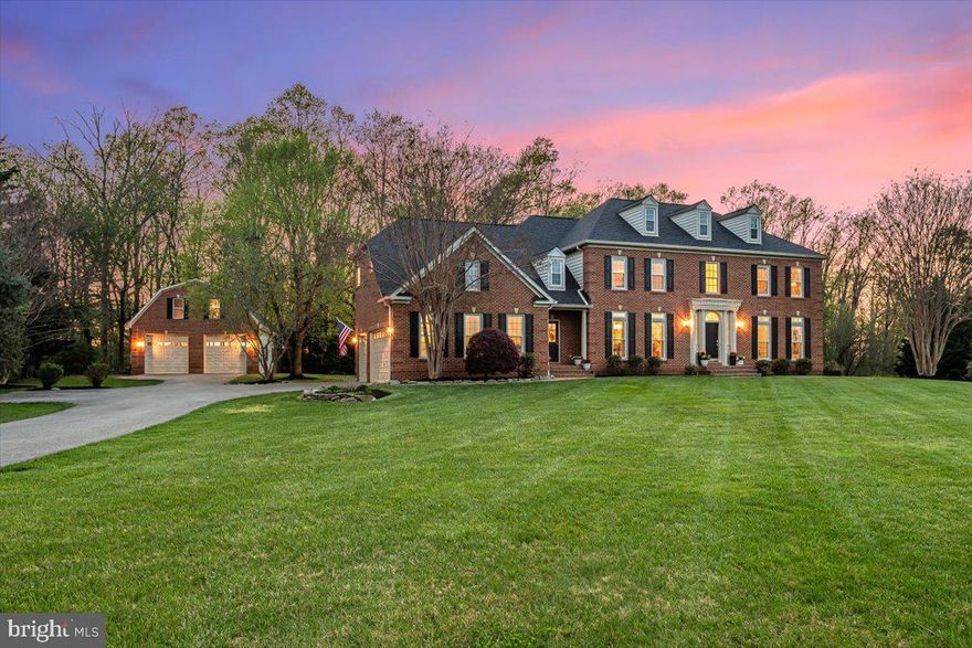 Welcome home to this impressive brick center hall colonial on 2+ acres on a private, manicured cul-de-sac!   This gracious property exudes elegance and warmth at the same time- a rare combination of breathtaking entertaining spaces and warm, unassuming casual spaces- all bathed in an abundance of natural light.  The main level offers an airy two-story foyer, open living and dining rooms, a powder room, a roomy office, a huge family room centered on a floor-to-ceiling stone fireplace with a two-story ceiling, a generous kitchen with a center island, a walk-in pantry, and a cheerful breakfast room overlooking the updated deck and lawn.  A dual-entry laundry room and entry to the attached three-car garage finish this floor.  Upstairs beckons with double staircases, a cavernous owners’ suite with a walk-in closet, spa bath with soaking tub, dual vanities, and a walk-in shower, 3 additional bedrooms, and two more full baths.  The lower level features a double-door walk-up to the lawn, brand-new luxury plank flooring, a full bath, and tons of storage.  The windows were replaced in 2025 (main house), and a new roof and HVAC system were installed in 2020.   The nearly 50-foot-long detached garage has oversized doors, room for lifts, water and electric, and a staircase to a second floor that awaits your finishing touches.  Store all your cars, toys, or even your pontoon boat (this owner does)- this structure is special!  This turnkey home offers privacy and serenity in a very special pastoral setting- a true forever home!