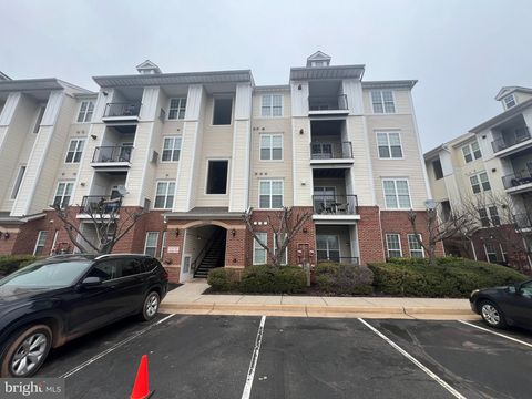 Photo of 21228 Mcfadden Square #413, STERLING, VA 20165 (MLS # VALO2117898)