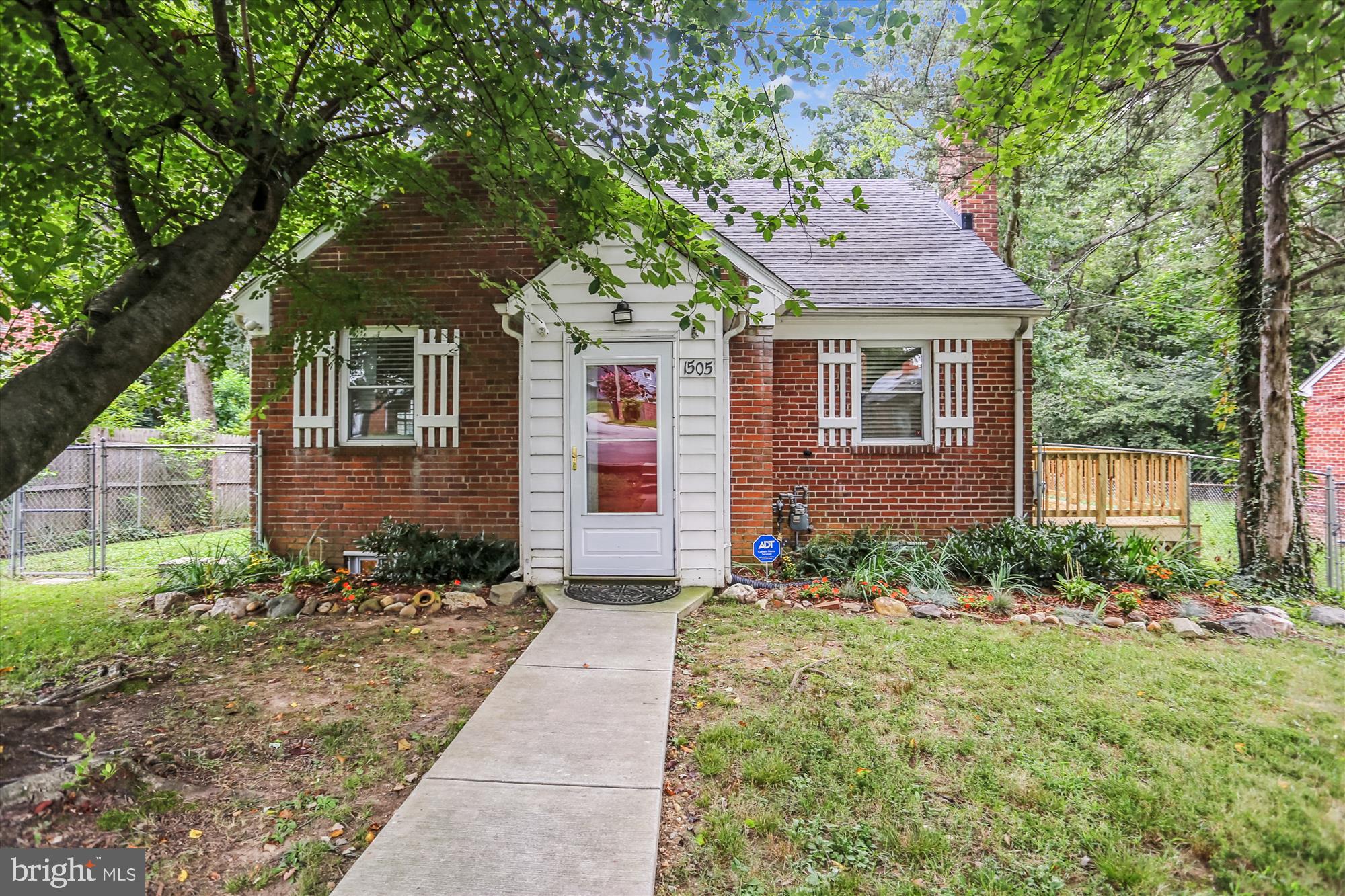Welcome to 1505 Drexel Street , a sweet Cape Cod in Takoma Park just steps away from the Sligo Creek Trail! This beautifully maintained home spans 2,021 square feet, featuring four spacious bedrooms and 2.5 bathrooms. The home includes hardwood floors, an inviting fireplace, and updated kitchens and baths. Enjoy the open, airy layout accentuated by a new side deck or patio out back! For more active days, hit the trail for a walk or head to the newly renovated Hillwood Manor playground just minutes away.
In addition to the central AC, the upper level provides zoned heating and cooling through mini-splits, ensuring comfort all year round. A finished walk-out basement extends your living space, offering a recreation area and work shop, complemented by a convenient laundry setup.
Situated on an expansive 8,371 square-foot lot, the home showcases a large, flat, fenced yard with a wonderful private treed view. Great for outdoor BBQs, romping with the kids or throwing a ball to the dog! Would also lend itself perfectly to an expansion if desired.