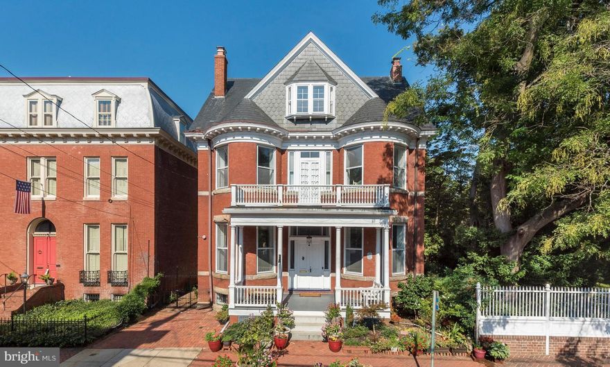 Elegant and welcoming brick Queen Anne Victorian in the heart of Downtown Annapolis. Enjoy easy living in this center hall floor plan with excellent flow and rooms for every purpose. Amazing restoration includes plaster walls, soaring ceilings, ceiling medallions, heart pine floors. Gorgeous preserved original interior shutters/windows/staircase/vestibule/sliding interior doors/front door & porch. Beautiful tile baths, updated heating/cooling, sprinkler system thru out, great eat-in kitchen with chef's range, wine cellar. Extra large lovely garden with a rare opportunity to add a pool and still have plenty of room for entertaining and relaxing. Home offers a wonderful opportunity for a large home office. Home has an excellent history of short term rentals. Maryland Avenue is the most charming street with boutiques, shops and restaurants.