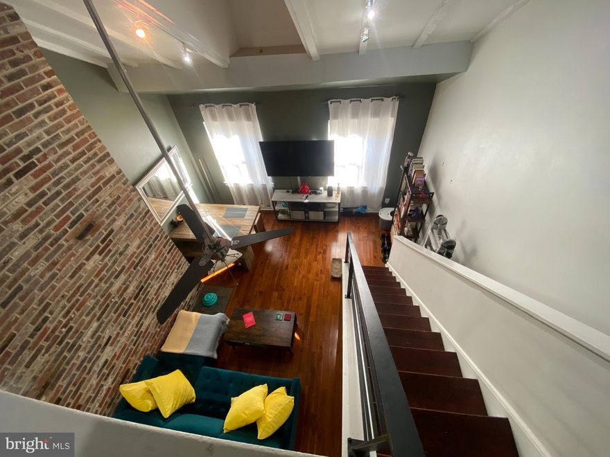 Welcome to this beautiful bi-level loft rental unit in old city!  Location Location Location! Right next to an abundance of good eats and night life this is the perfect apartment for you. The bi-level layout present features such as, high vaulted ceilings, and exposed brick accent wall, and newly finished hardwood floors though out. The kitchen presents plenty of cabinet space, a breakfast bar and beautiful white quarts counter tops perfect that is perfect for cooking at! The first floor rounds out with a smaller bedroom/ office and a full bathroom. The master bedroom upstairs overlooks the living room giving it the perfect loft feel! The master bathroom is finished with brand new custom tile work and a frameless shower, and spa bath.  Washer and drying in the unit as well!!!