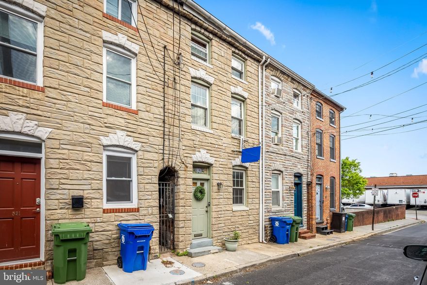 Located in the Fells Point Historic District on a quiet street, this eclectic 2-bedroom, 1-bathroom townhome is loaded with warmth and character. Charm abounds with the exposed brick, built-in nooks, stained glass, exposed beams, wood floors and all around cool vibe. The third floor is especially enchanting with skylights, red brick and wood beams. Use your imagination in creating the perfect green space in the unusually large rear yard. A second floor deck is accessible from the back patio. The kitchen features a newer gas range and plenty of counter space. The HVAC was recently replaced for peace of mind and efficiency. The tankless water heater provides an endless supply of hot water for the bath and kitchen.  This home is ready for you to move in and make it your own!