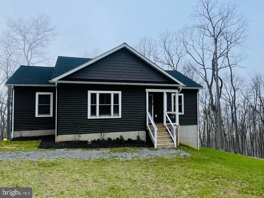 Fantastic opportunity with 6 Bedrooms and 3 full bathrooms. Luxury vinyl plank flooring throughout, vaulted ceilings in the Kitchen, Dining And Living Room. Floor to ceiling stone Fireplace with Propane Logs. Quartz counter tops with upgraded appliances. 10' X 16' Rear Deck with stunning views! Full Finished Basement with Full Bathroom and Office Space (6Th Bedroom), Plenty of natural light. Minutes To I-66 for an easy commuter experience.