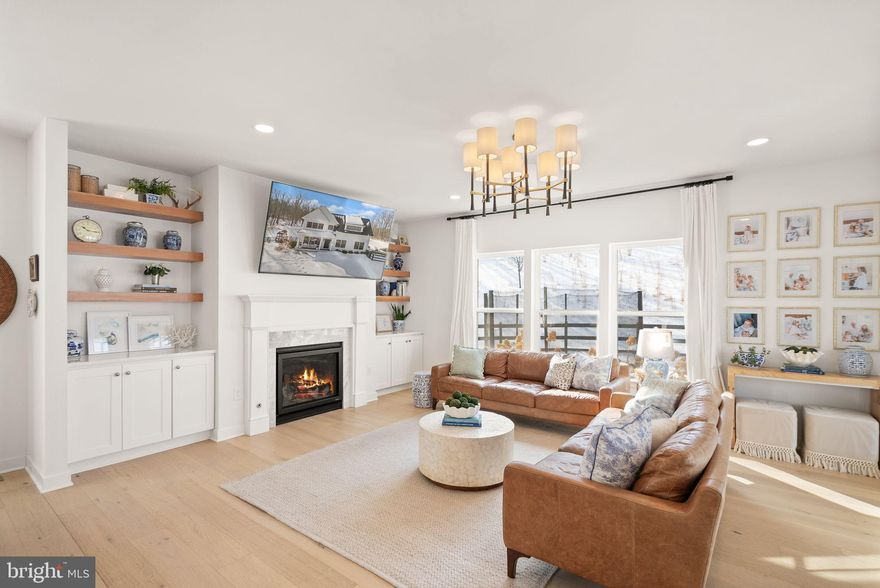 A private 10-acre Aldie estate thoughtfully curated and designed as a peaceful countryside retreat.

Set across ten breathtaking acres with NO HOA, this extraordinary custom-built residence by MAC Builders offers the rare opportunity to experience refined estate living surrounded by nature. Mature trees, open skies, and sweeping views create an atmosphere of calm and privacy while the home reflects timeless craftsmanship and thoughtful design.

Inside, a light-filled open floor plan unfolds with effortless elegance. The gourmet white kitchen, complemented by an expansive pantry and exceptional storage, flows seamlessly into the inviting family room anchored by a warm gas fireplace and the open dining area, creating a beautiful space for both everyday living and entertaining.

A main-level bedroom with a full custom bath provides the perfect setting for guests, extended family, or multi-generational living. Just beyond the living spaces, a covered porch invites you to slow down and enjoy quiet mornings, peaceful evenings, and uninterrupted views of the surrounding countryside.

Upstairs, the home offers four spacious bedrooms and three and a half baths, including a stunning primary suite designed as a private retreat. Wake to serene views and step directly onto your private upper-level deck overlooking the property. The spa-inspired primary bath features dual vanities, a freestanding soaking tub, a beautifully designed custom shower, and an impressive wrap-around walk-in closet. An upper-level laundry room adds everyday convenience.

The walk-up lower level expands the home’s lifestyle offerings with a large recreation area, custom bar, an additional bedroom, and a full bath, along with a custom-built playroom designed to inspire fun for all ages.

Outside, the property continues to impress with a fully fenced front yard, two-car garage, and a custom-built shed that can serve as a secondary garage, workshop, or additional storage space. The outdoor playset conveys with the home, adding another wonderful feature to the expansive outdoor setting.

Served by private well and septic, this remarkable property offers the rare combination of acreage, privacy, and modern luxury while remaining just minutes from Aldie, shopping, dining, commuter routes, and the best of Loudoun County living—and just 10 minutes from Middleburg, offering convenient access to its charming shops, restaurants, and historic small-town atmosphere.

A truly special Northern Virginia countryside estate where every sunrise feels peaceful, every gathering feels special, and every day feels like coming home.